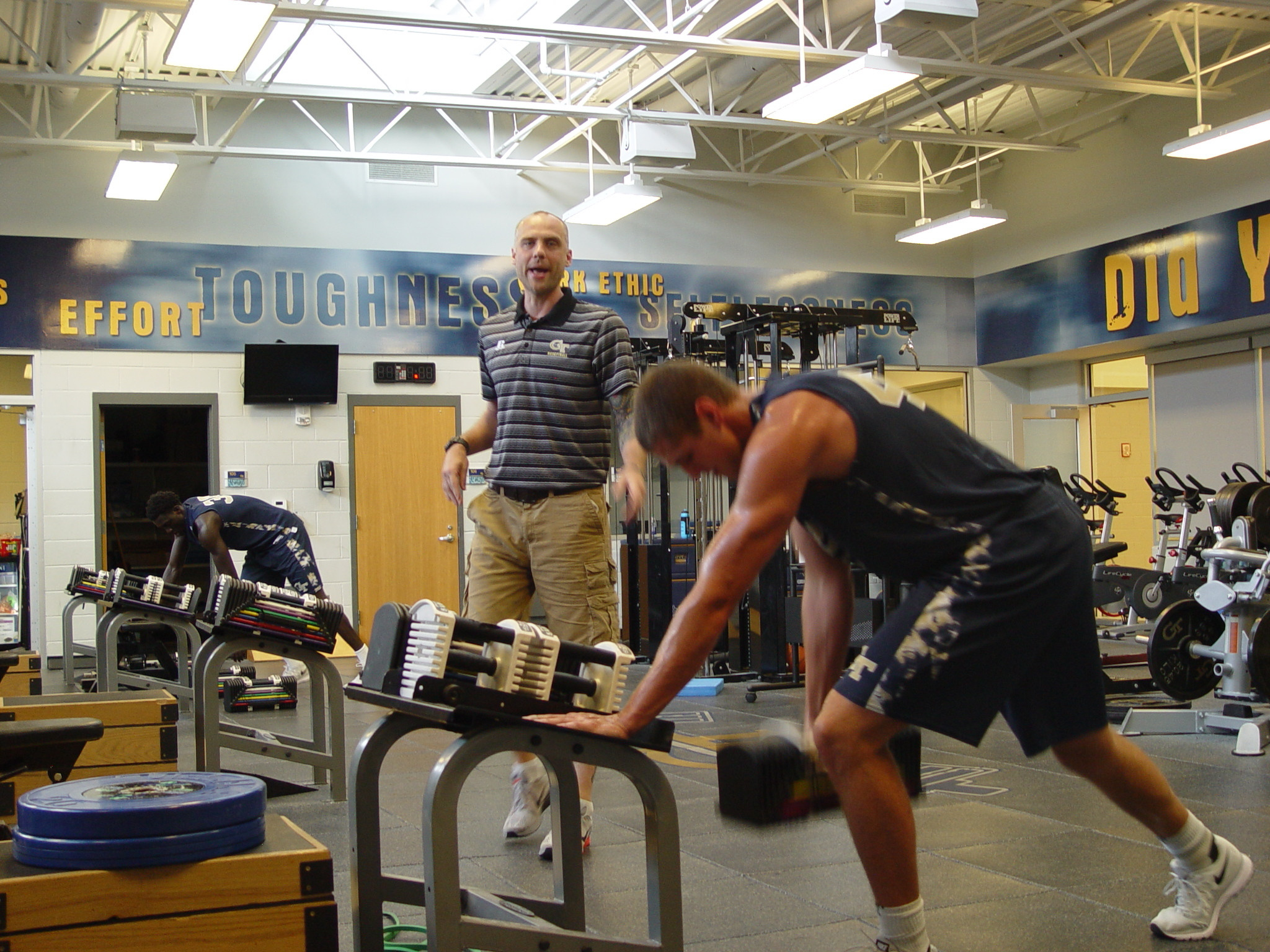 Player development coach Dan Taylor takes the Georgia Tech men's basketball team through a workout on June 16, 2016 in the Zelnak Center weight room.