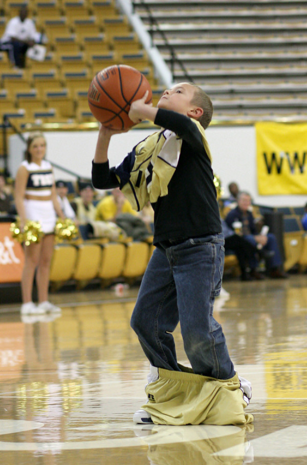 A fan participates in a contest during a timeout