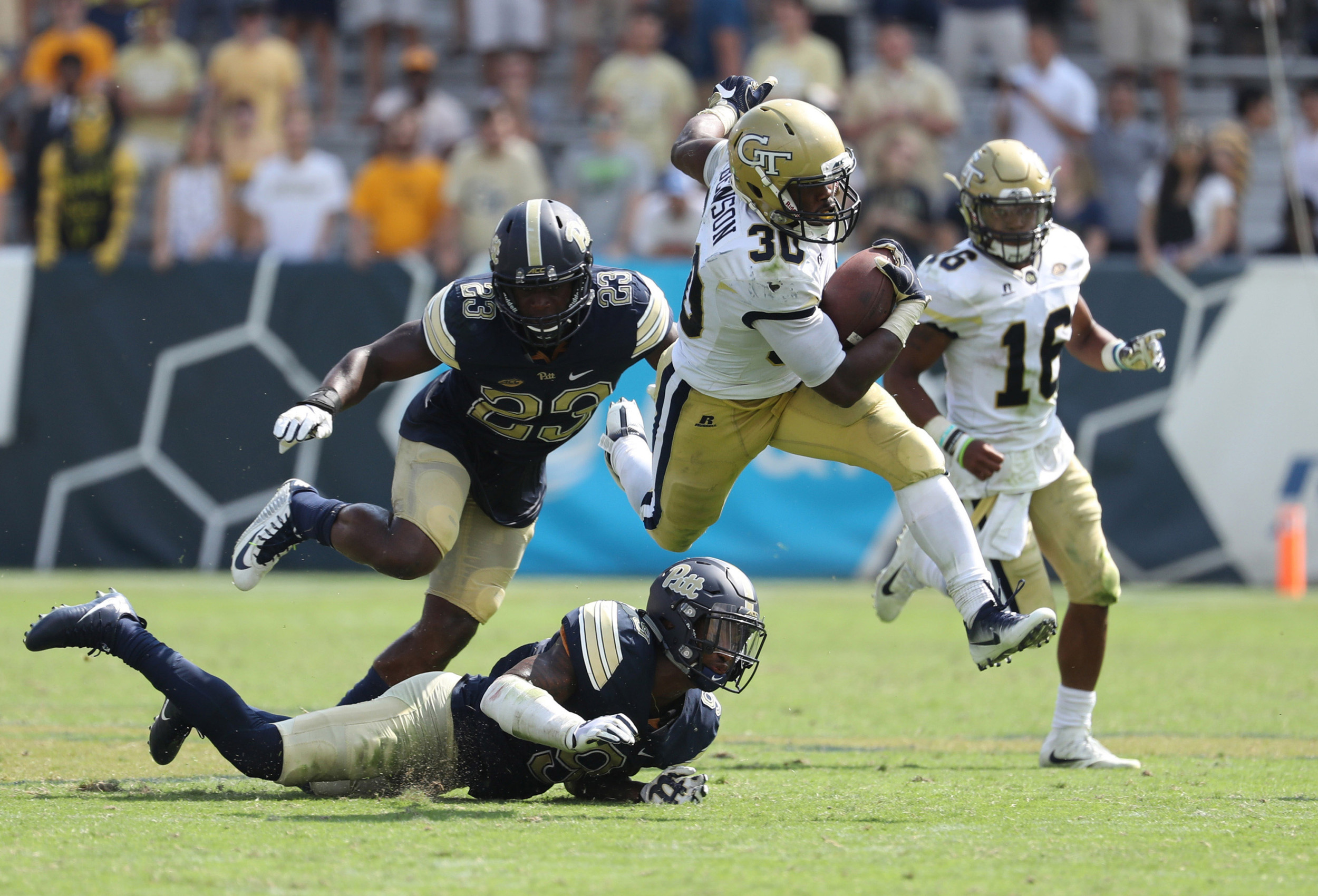 Sep 23, 2017; Atlanta, GA, USA; Georgia Tech Yellow Jackets running back KirVonte Benson (30) runs for a 47-yard touchdown run in the fourth quarter against the Pittsburgh Panthers at Bobby Dodd Stadium. Mandatory Credit: Jason Getz-USA TODAY Sports