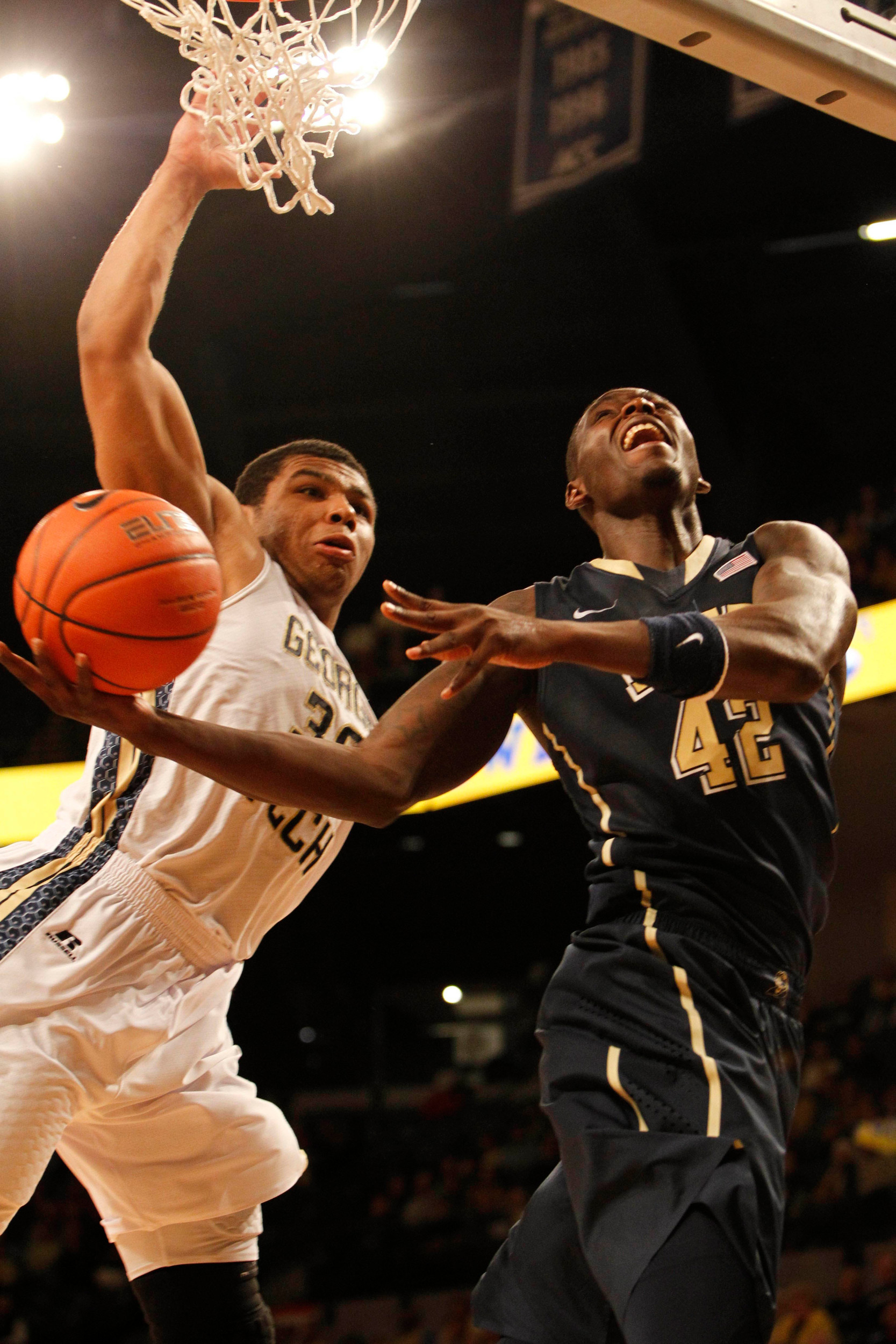 Jan 14, 2014; Atlanta, GA, USA; Georgia Tech Yellow Jackets guard Corey Heyward (30) defends Pittsburgh Panthers forward Talib Zanna (42) in the second half at Hank McCamish Pavilion. Pittsburgh defeated Georgia Tech 81-74. Mandatory Credit: Brett Davis-USA TODAY Sports