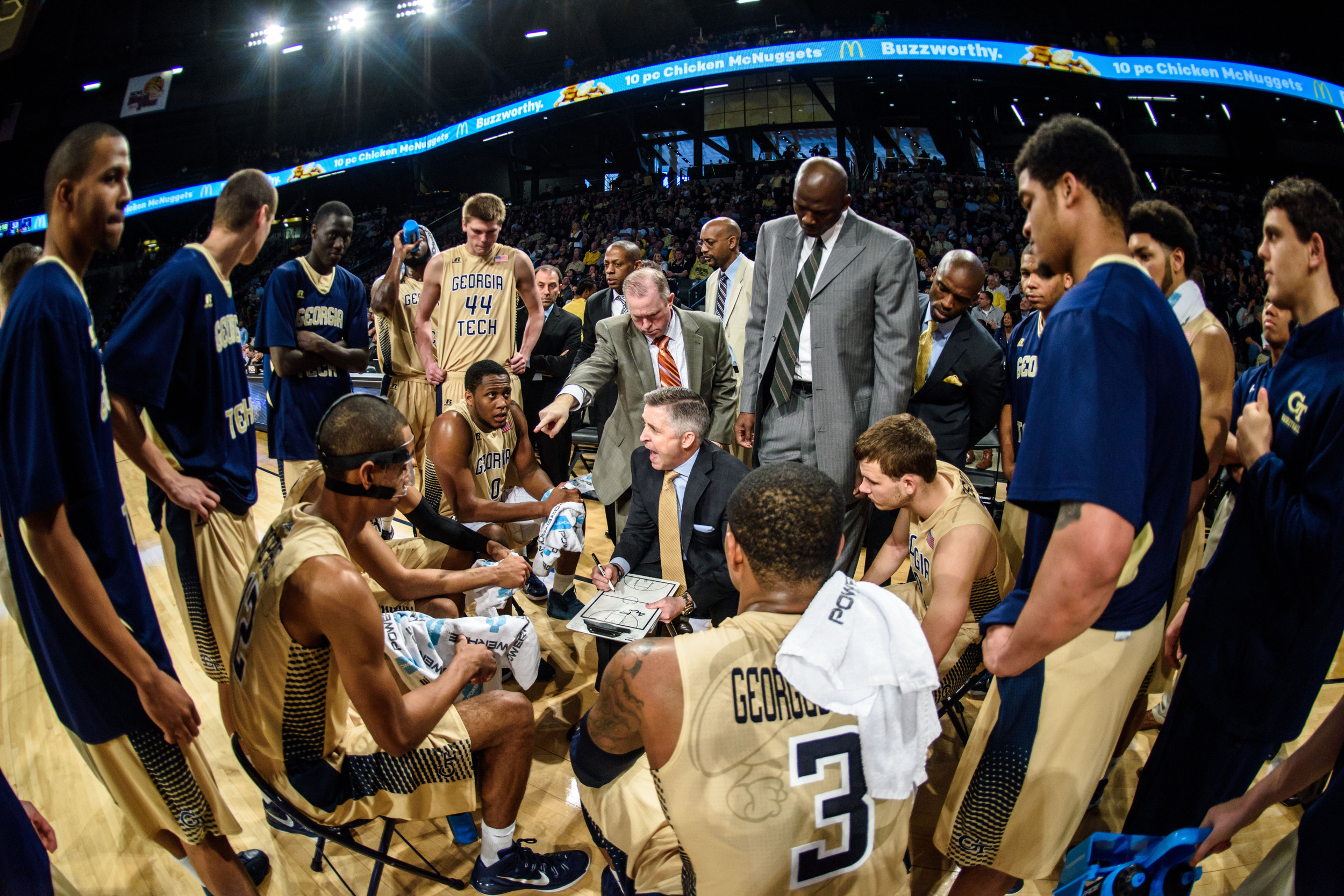 Coach Gregory talks to the team during a timeout