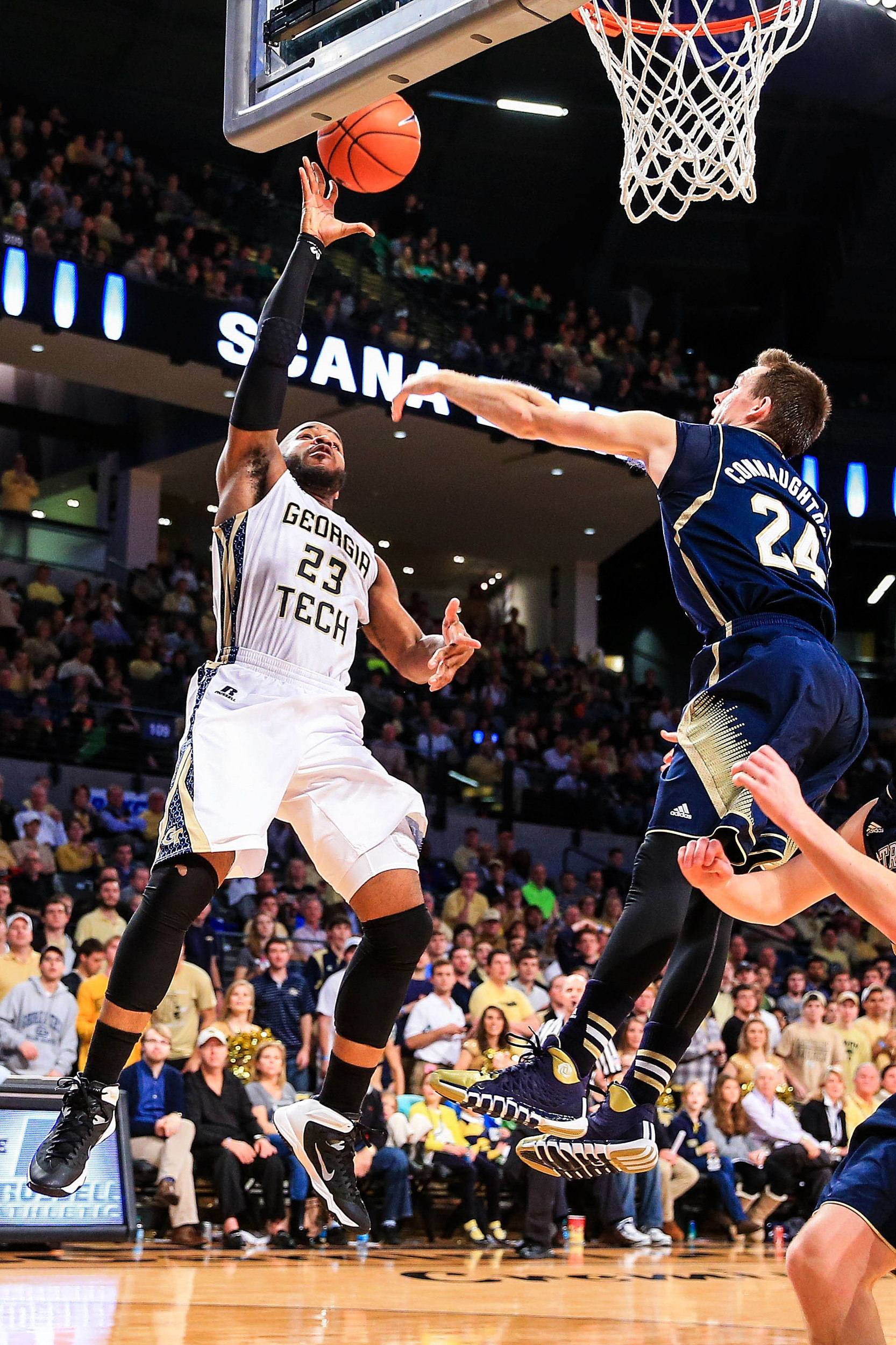 Jan 11, 2014; Atlanta, GA, USA; Georgia Tech Yellow Jackets guard Trae Golden (23) shoots a basket past Notre Dame Fighting Irish guard/forward Pat Connaughton (24) in the second half at Hank McCamish Pavilion. Georgia Tech won 74-69. Mandatory Credit: Daniel Shirey-USA TODAY Sports