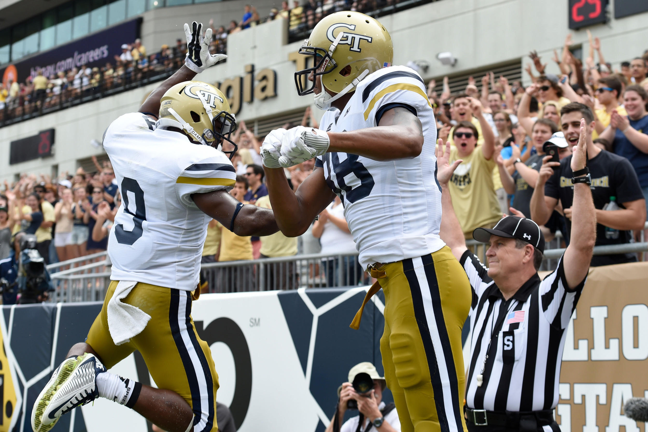 Sep 13, 2014; Atlanta, GA, USA; Yellow Jackets wide receiver Darren Waller (88) reacts with running back Tony Zenon (9) after catching a touchdown pass during the first half. Dale Zanine-USA TODAY Sports