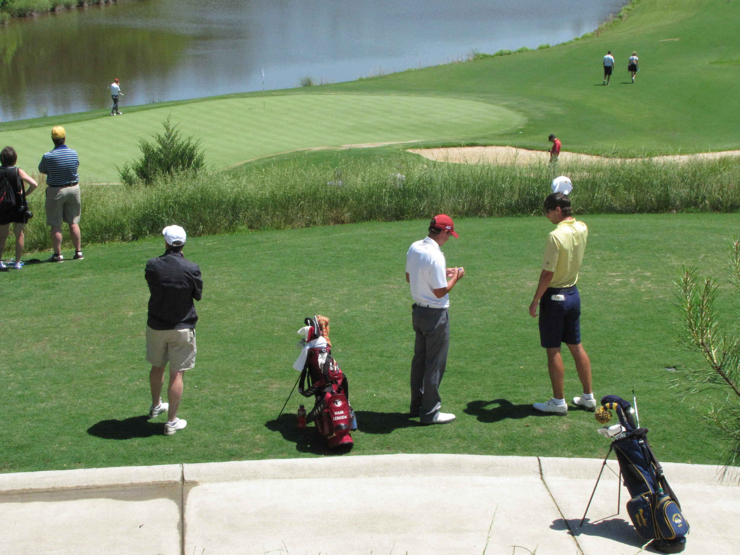 Seth Reeves waits by the 16th tee to re-start round 1 Friday at the NCAA Raleigh Regional, May 16, 2014