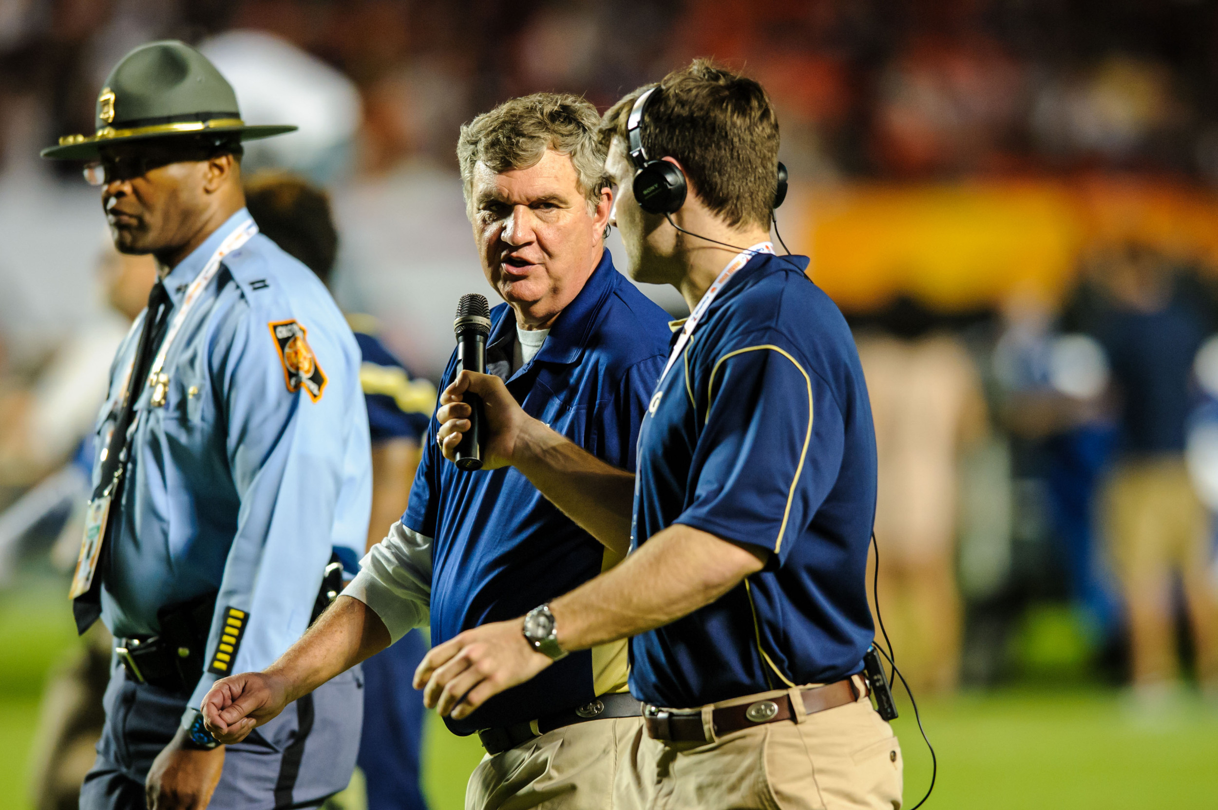 Coach Paul Johnson talks to Sean Bedford at halftime