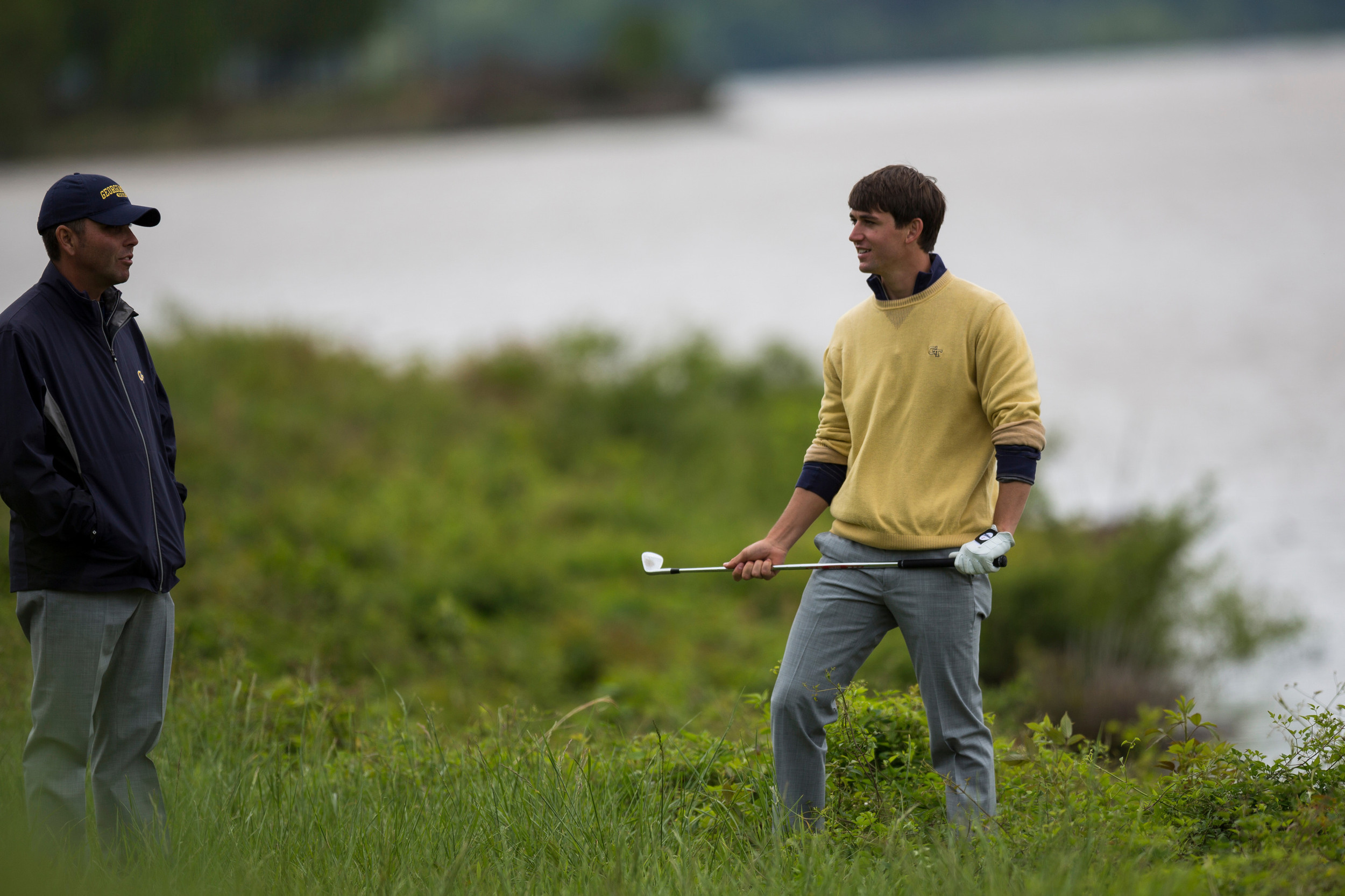 Associate head coach Brennan Webb and Ollie Schniederjans consult a shot during the playoff of the ACC Golf Championship, April 26, 2015, Old North State Club, New London, N.C.