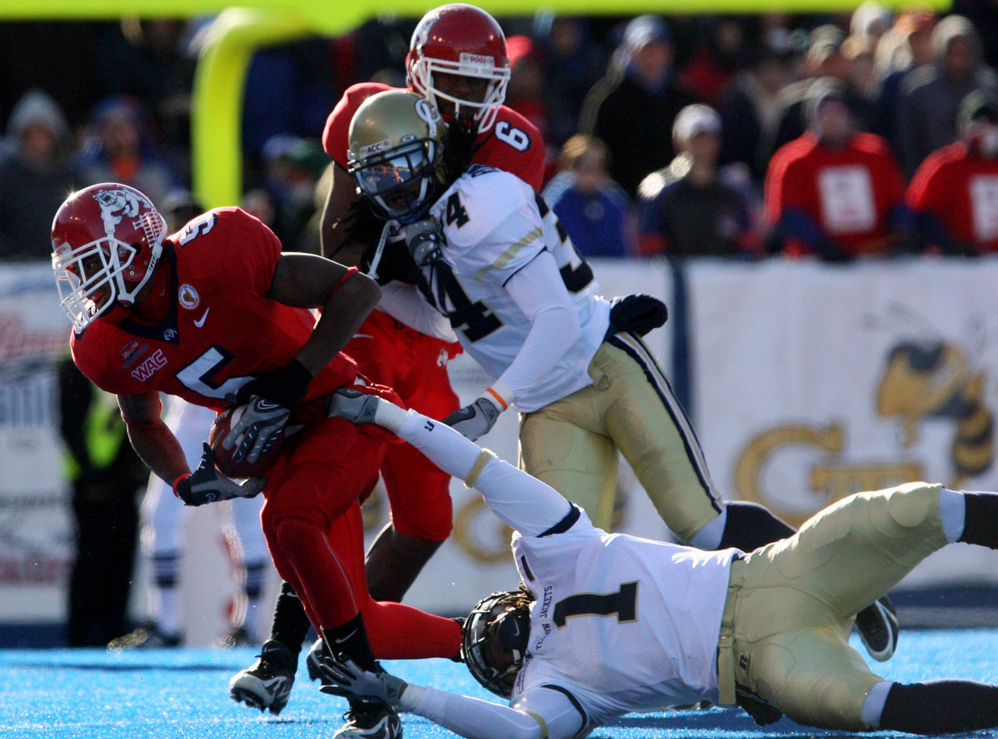 Fresno State wide receiver Marlon Moore looks to pick up a few yards against Georgia Tech's safety Morgan Burnett.