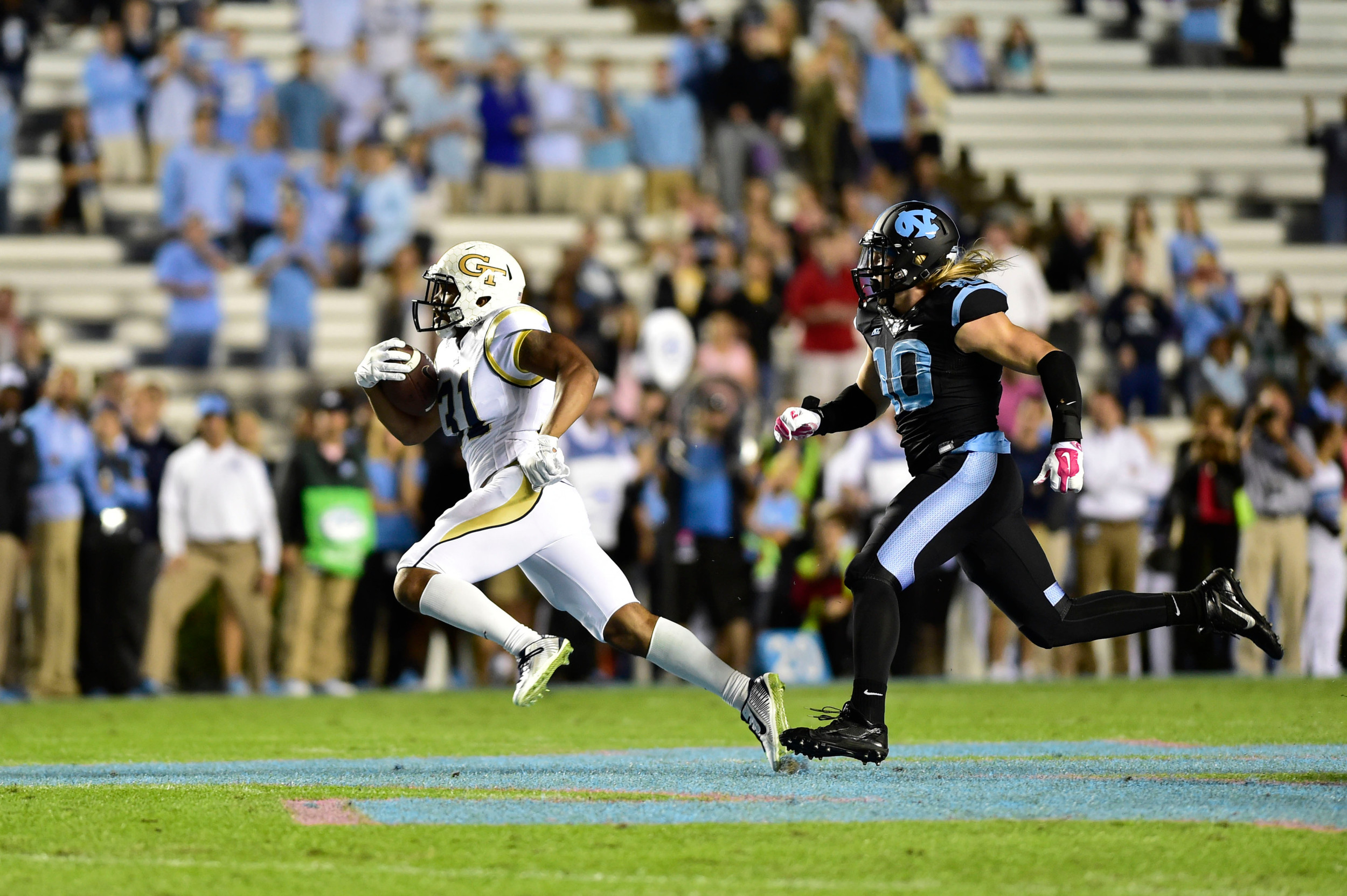 Georgia Tech Yellow Jackets running back Deon Hill (31) with the ball as North Carolina Tar Heels linebacker Jeff Schoettmer (10) defends in the first quarter at Kenan Memorial Stadium. Mandatory Credit: Bob Donnan-USA TODAY Sports