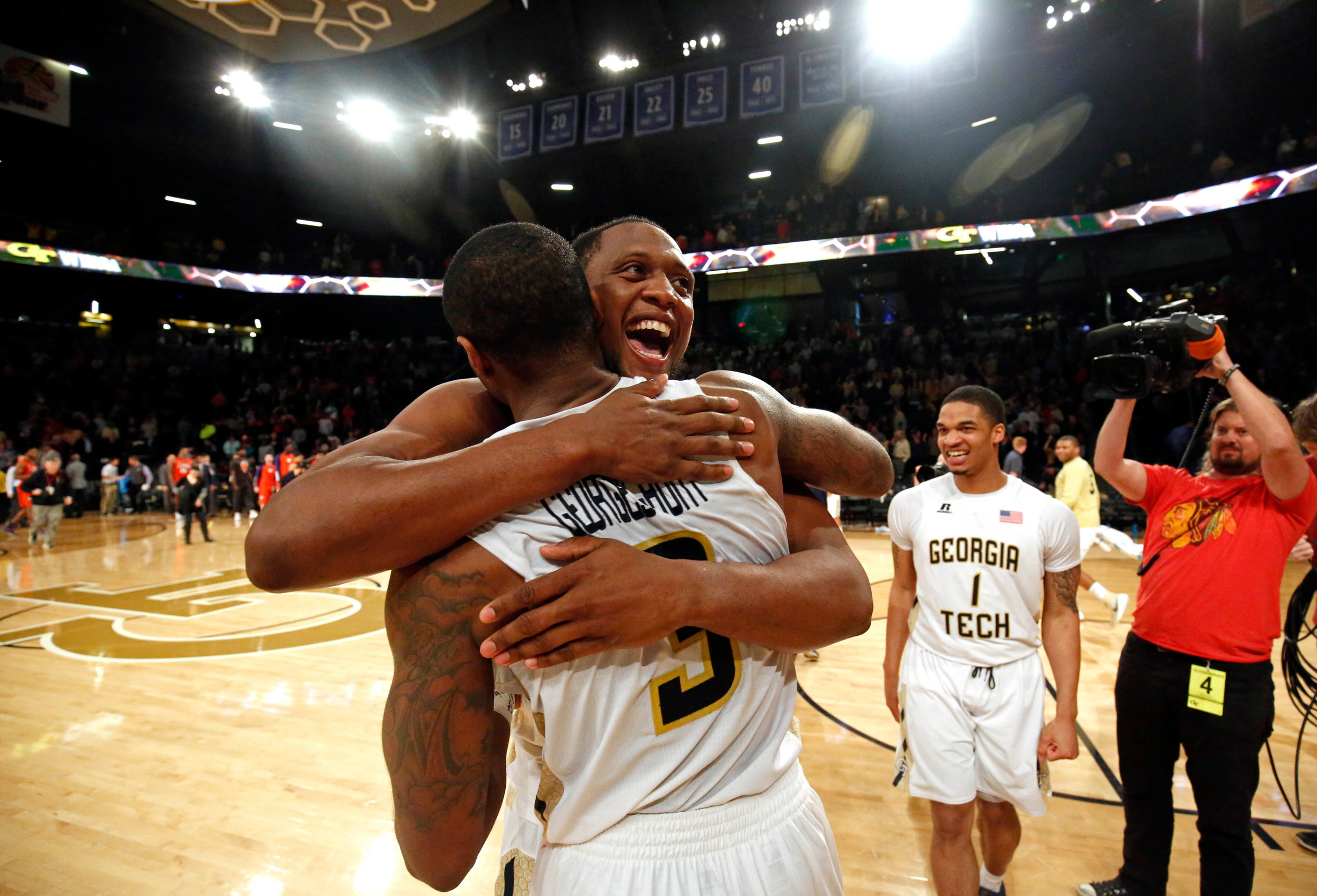 Charles Mitchell (0, facing) celebrates with guard Marcus Georges-Hunt (3) after the Georgia Tech Yellow Jackets defeated the Clemson Tigers at McCamish Pavilion. The Yellow Jackets won 75-73. Jason Getz-USA TODAY Sports