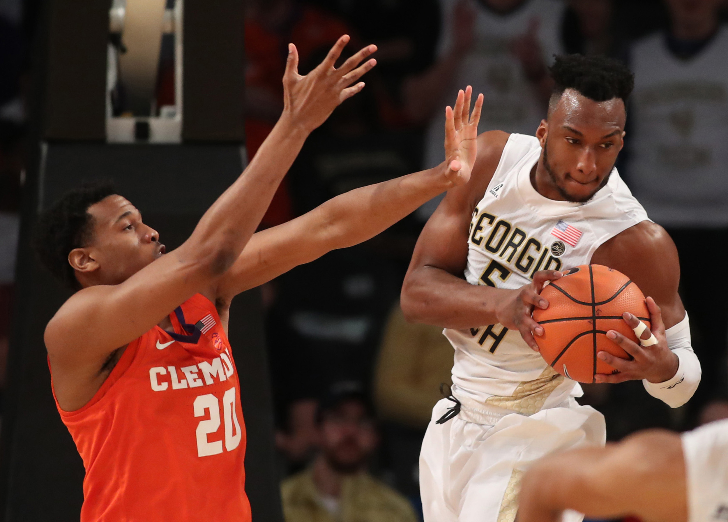 Jan 28, 2018; Atlanta, GA, USA; Georgia Tech Yellow Jackets guard Josh Okogie (5) grabs a rebound against Clemson Tigers forward Malik William (20) during the first half at McCamish Pavilion. Mandatory Credit: Jason Getz-USA TODAY Sports