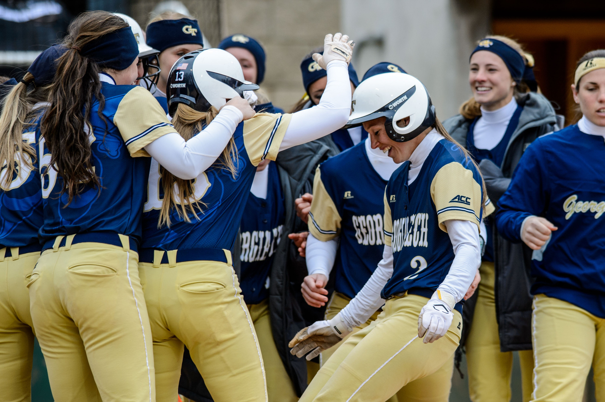 Maddie Lionberger (2) is met at the plate by teammates after hitting a home run