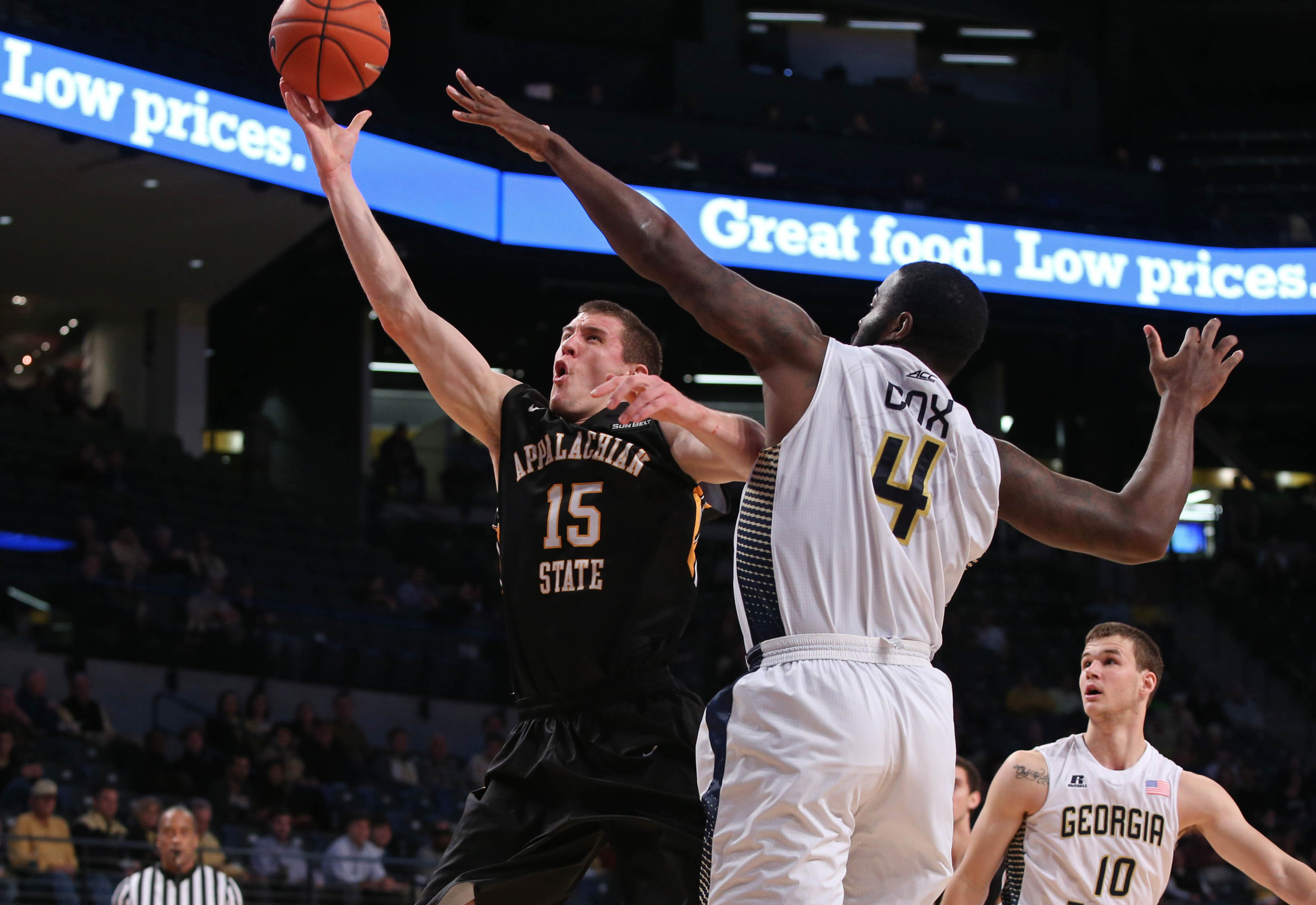 Dec 15, 2014; Atlanta, GA, USA; Appalachian State Mountaineers forward Tommy Spagnolo (15) attempts a shot against Georgia Tech Yellow Jackets center Demarco Cox (4) in the first half of their game at McCamish Pavilion. Mandatory Credit: Jason Getz-USA TODAY Sports