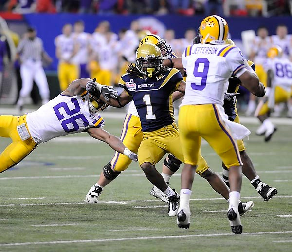 Morgan Burnett (1) flies in to disrupt LSU quaterback Jordan Jefferson's pass attempt. Photo by LensEffects
