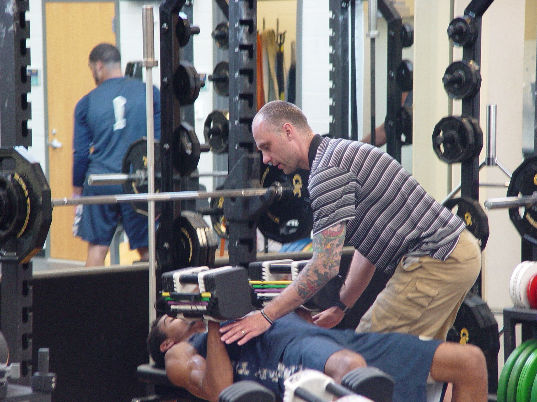 Player development coach Dan Taylor takes the Georgia Tech men's basketball team through a workout on June 16, 2016 in the Zelnak Center weight room.