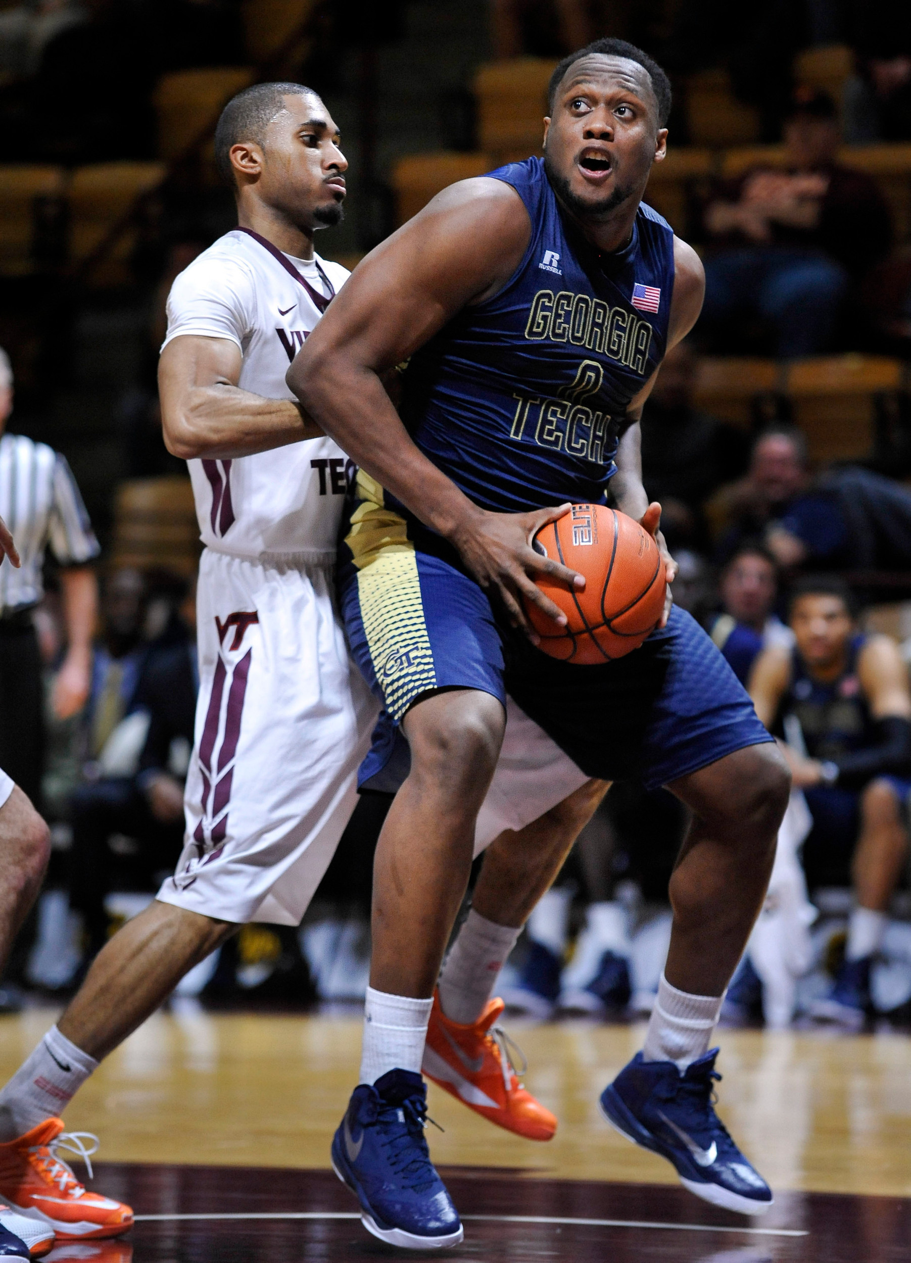 Feb 9, 2015; Blacksburg, VA, USA; Georgia Tech Yellow Jackets forward Charles Mitchell (0) drives to the basket while being defended by Virginia Tech Hokies guard Adam Smith (3) in the second half at Cassell Coliseum. Virginia Tech defeated Georgia Tech 65-63. Mandatory Credit: Michael Shroyer-USA TODAY Sports