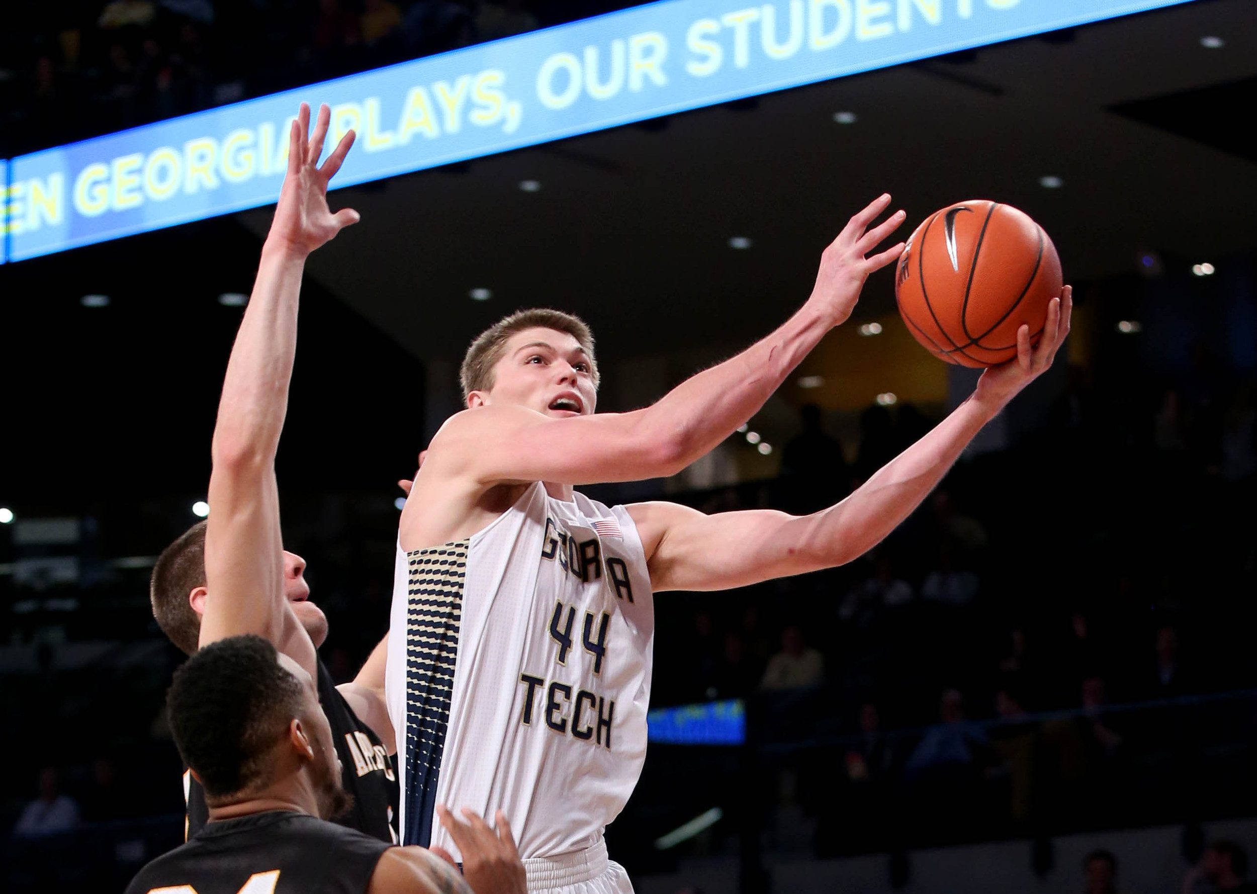 Dec 15, 2014; Atlanta, GA, USA; Georgia Tech Yellow Jackets center Ben Lammers (44) attempts a shot defended by an Appalachian State Mountaineers defender in the first half of their game at McCamish Pavilion. Mandatory Credit: Jason Getz-USA TODAY Sports