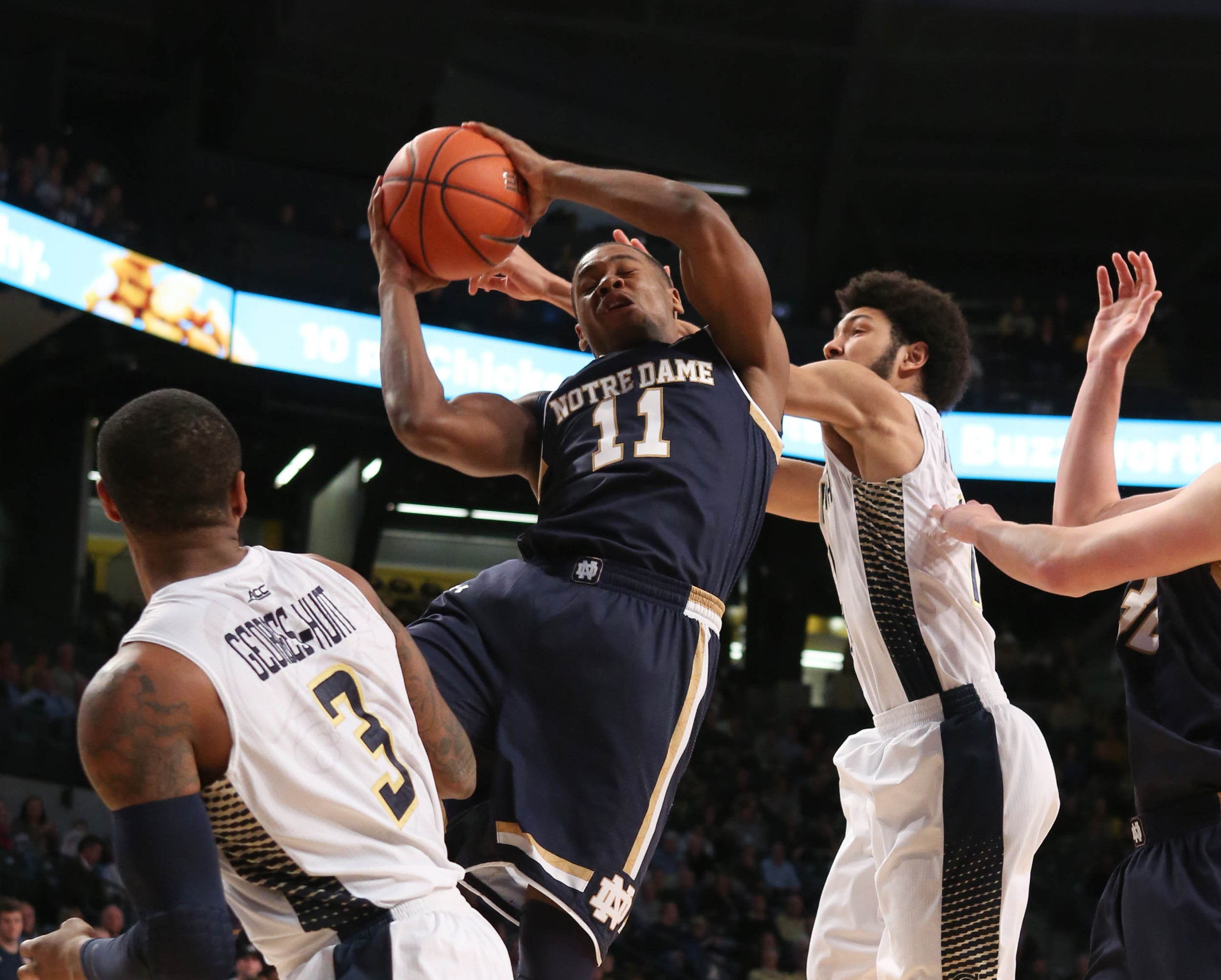 Jan 14, 2015; Atlanta, GA, USA; Notre Dame Fighting Irish guard Demetrius Jackson (11) grabs a rebound against Georgia Tech Yellow Jackets guard Josh Heath (11) in the first half of their game at McCamish Pavilion.