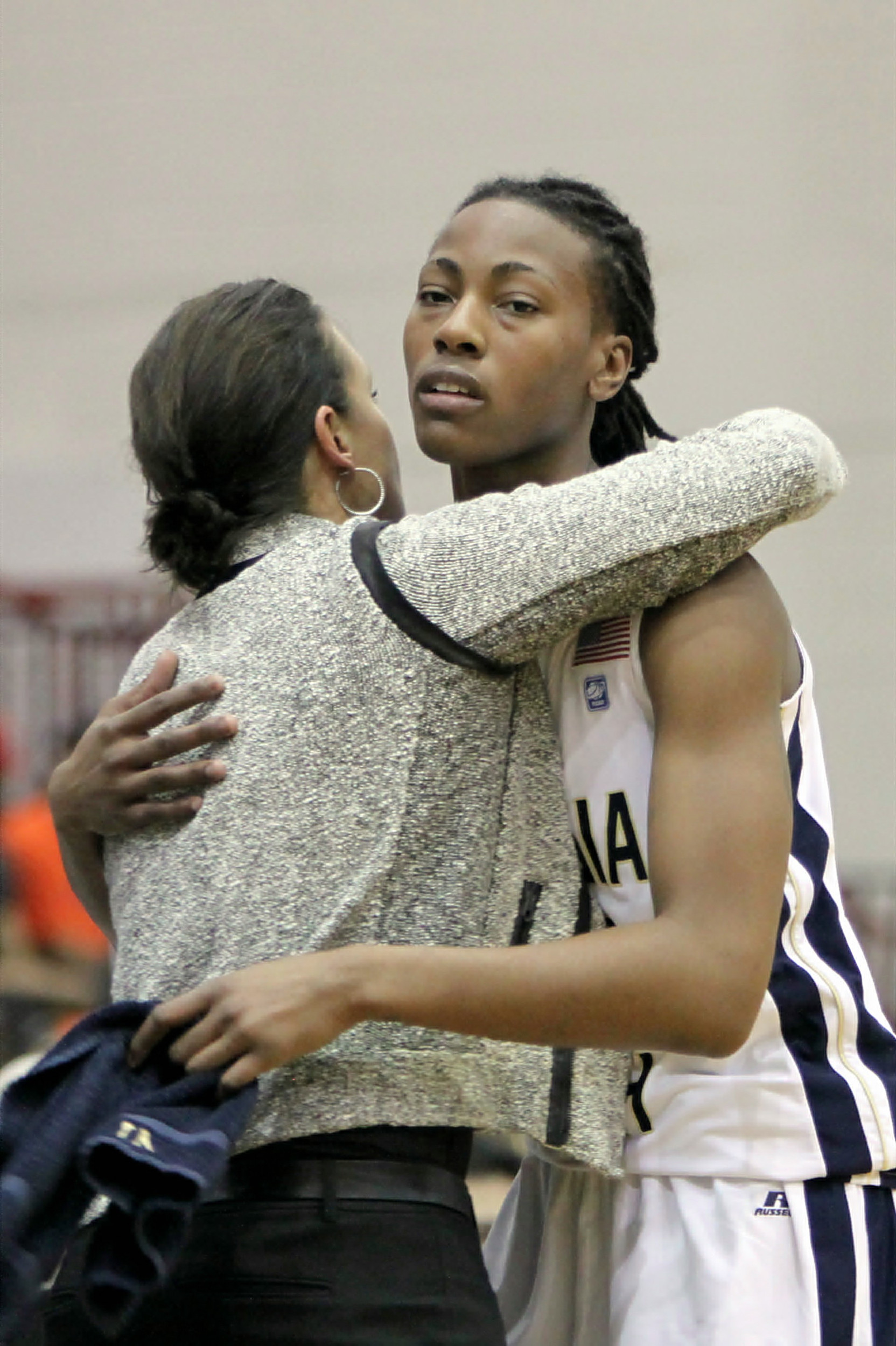 Head Coach MaChelle Joseph gives a hug to Chelsea Regins when she comes out of the game on Senior Day.