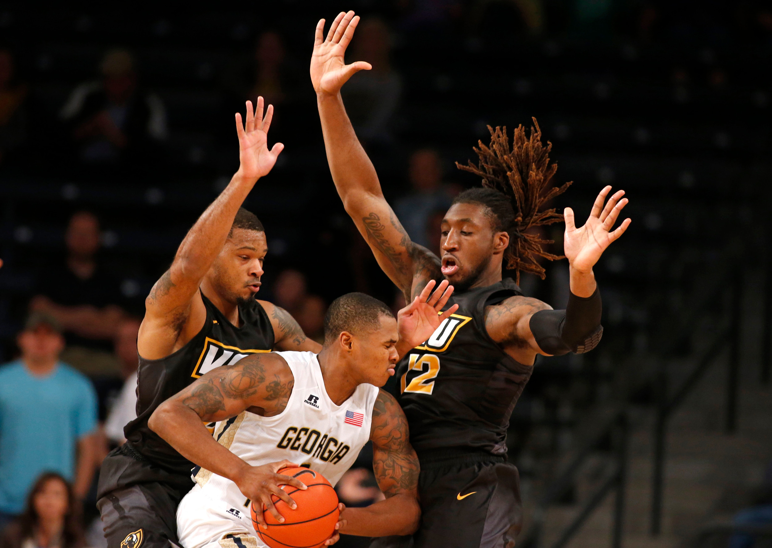 Georgia Tech guard Marcus Georges-Hunt tries to get out of the defense of VCU Rams guard Jordan Burgess and forward Mo Alie-Cox in the first half of their game at McCamish Pavilion. Credit: Jason Getz-USA TODAY Sports