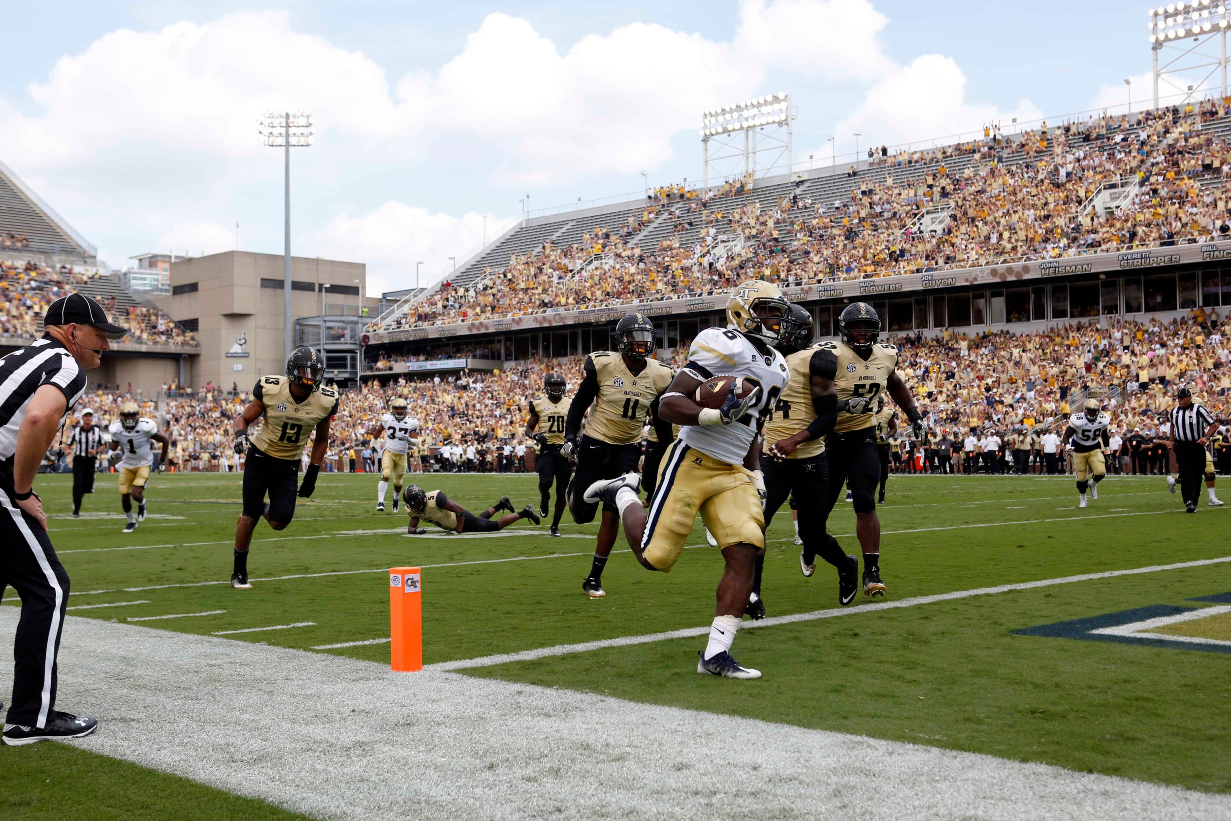 Yellow Jackets running back Dedrick Mills (26) scores a rushing touchdown in the first quarter. Jason Getz-USA TODAY Sports
