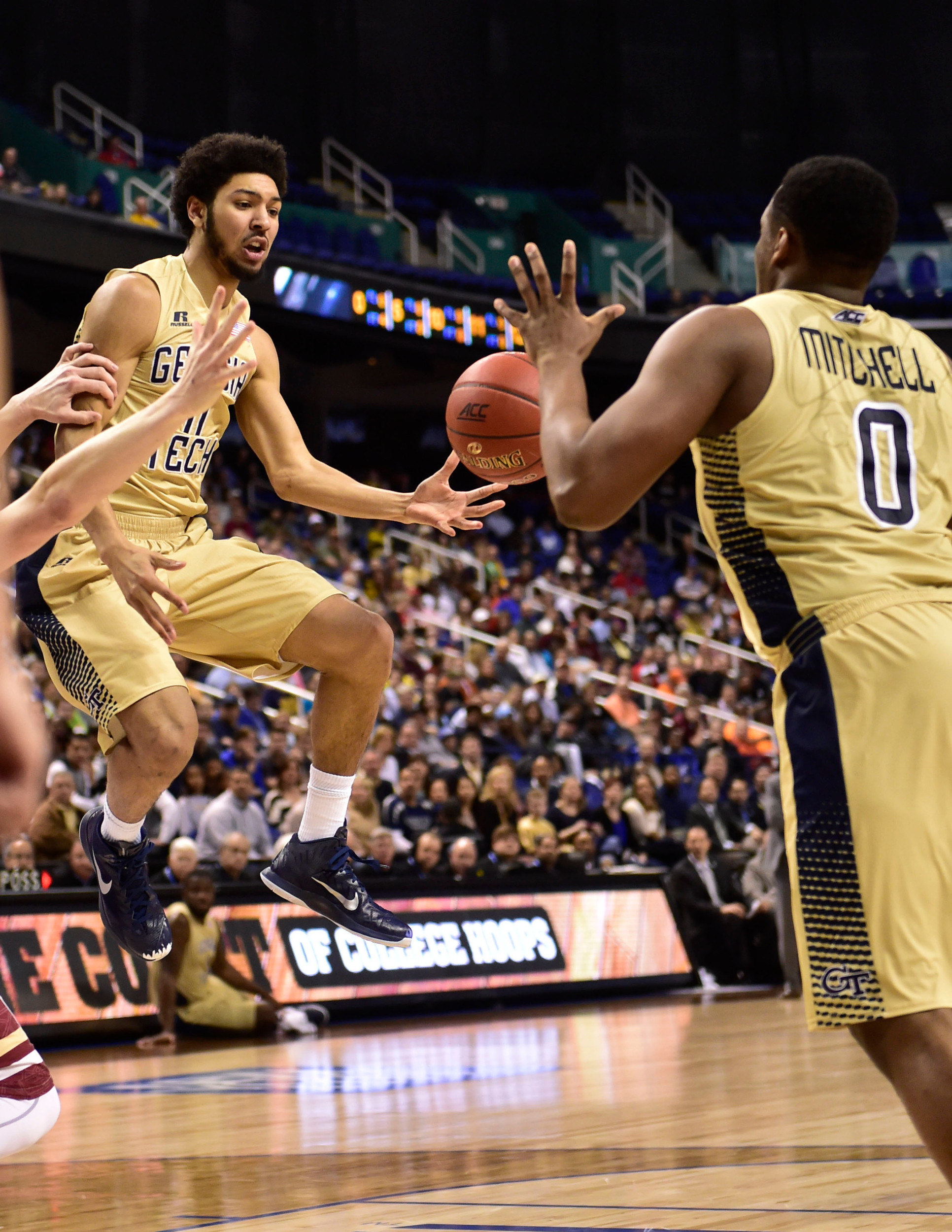 Georgia Tech Yellow Jackets guard Josh Heath (11) passes the ball to forward Charles Mitchell (0) in the first half of the first round of the ACC Tournament at Greensboro Coliseum. Mandatory Credit: Bob Donnan-USA TODAY Sports