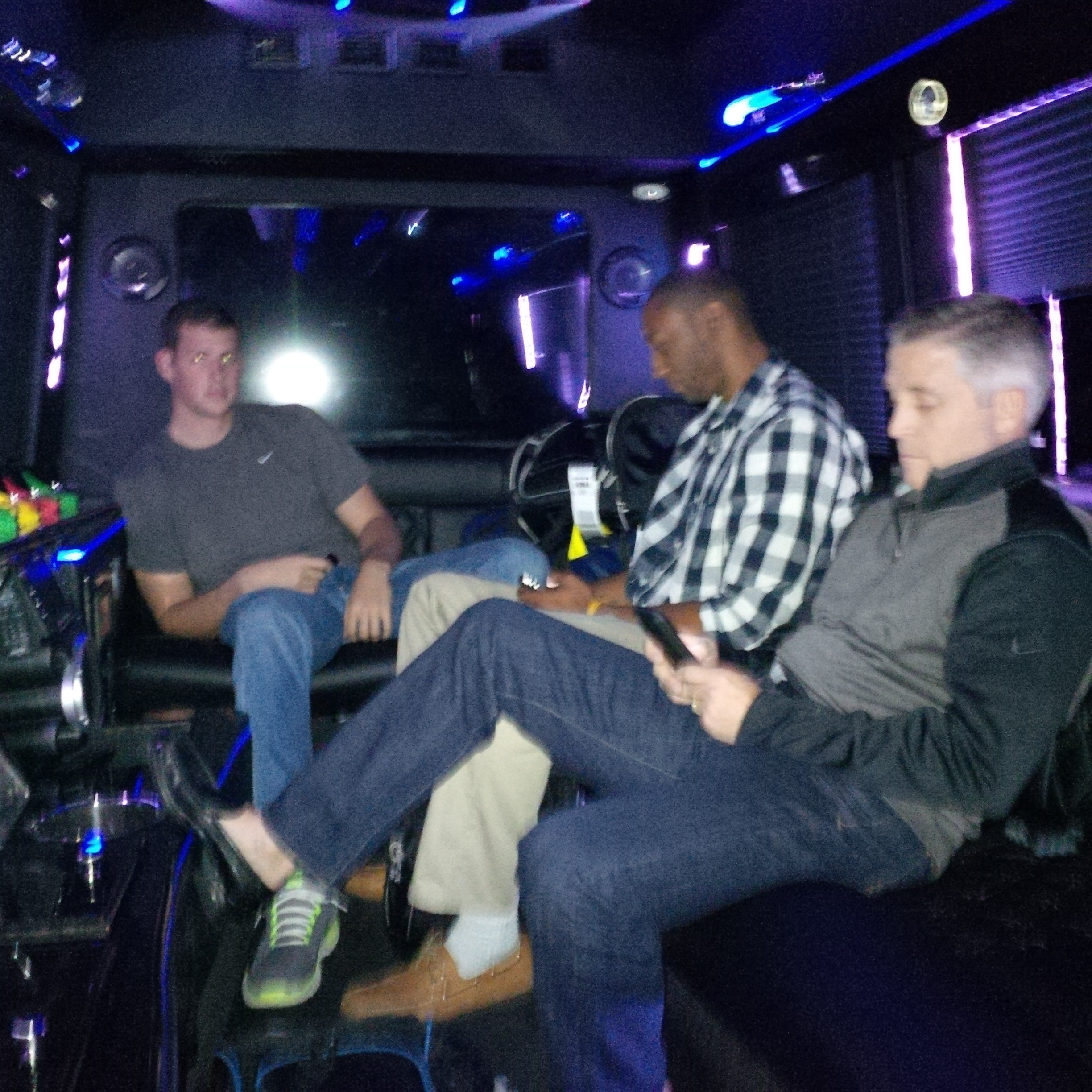 Daniel Miller, Kammeon Holsey and Coach Gregory on the bus to the hotel for ACC Operation Basketball