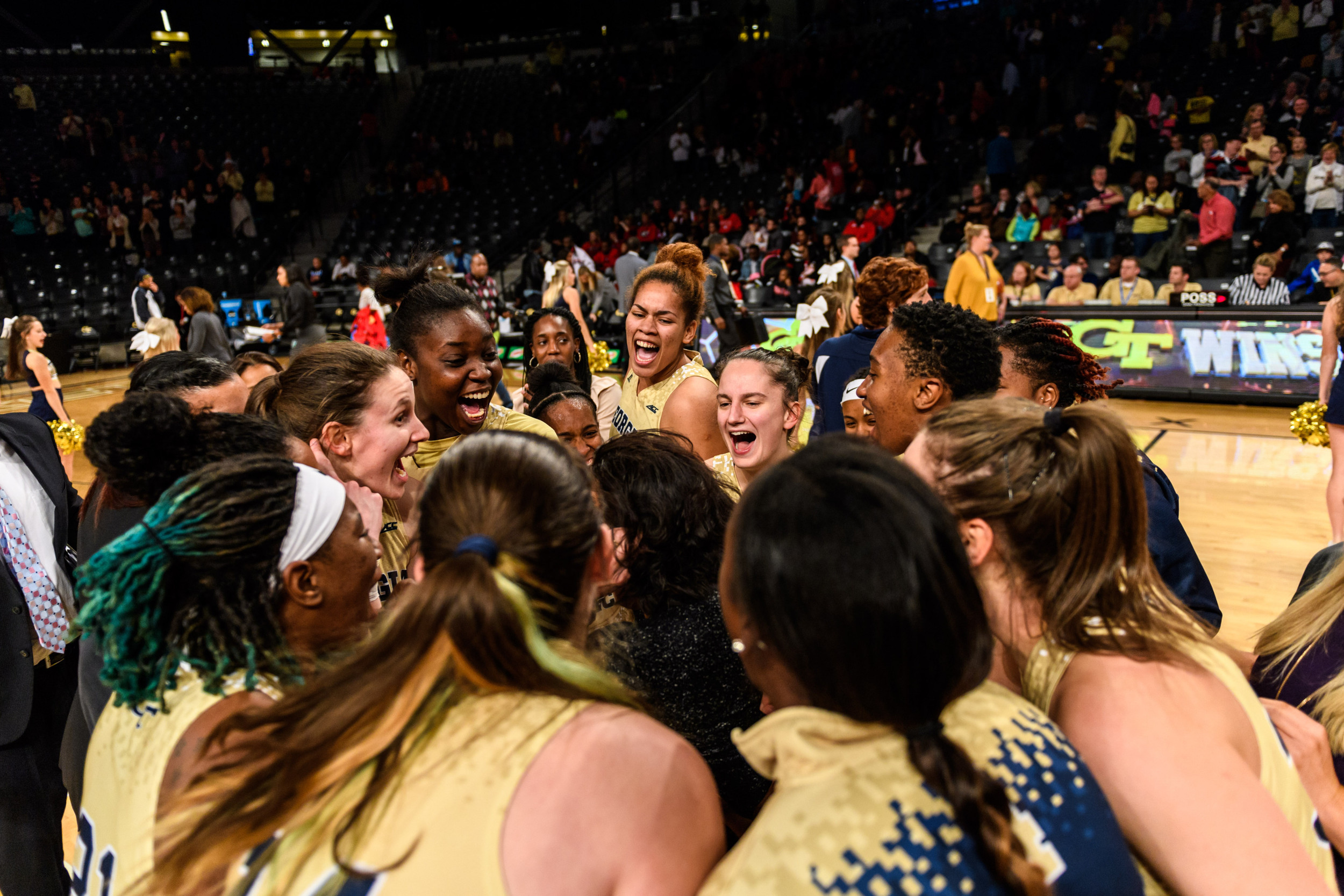 Coach Joseph celebrates with the team after the win