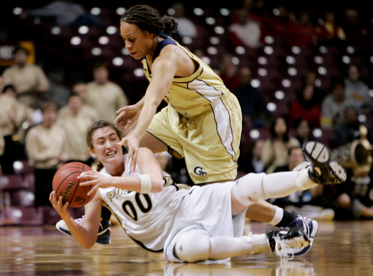 Purdue's Jodi Howell (00) tries to keep control of the basketball away from Stehpanie Higgs in first half of the second round of the NCAA tournament Monday, March 19, 2007 in Minneapolis. (AP Photo/Jim Mone)