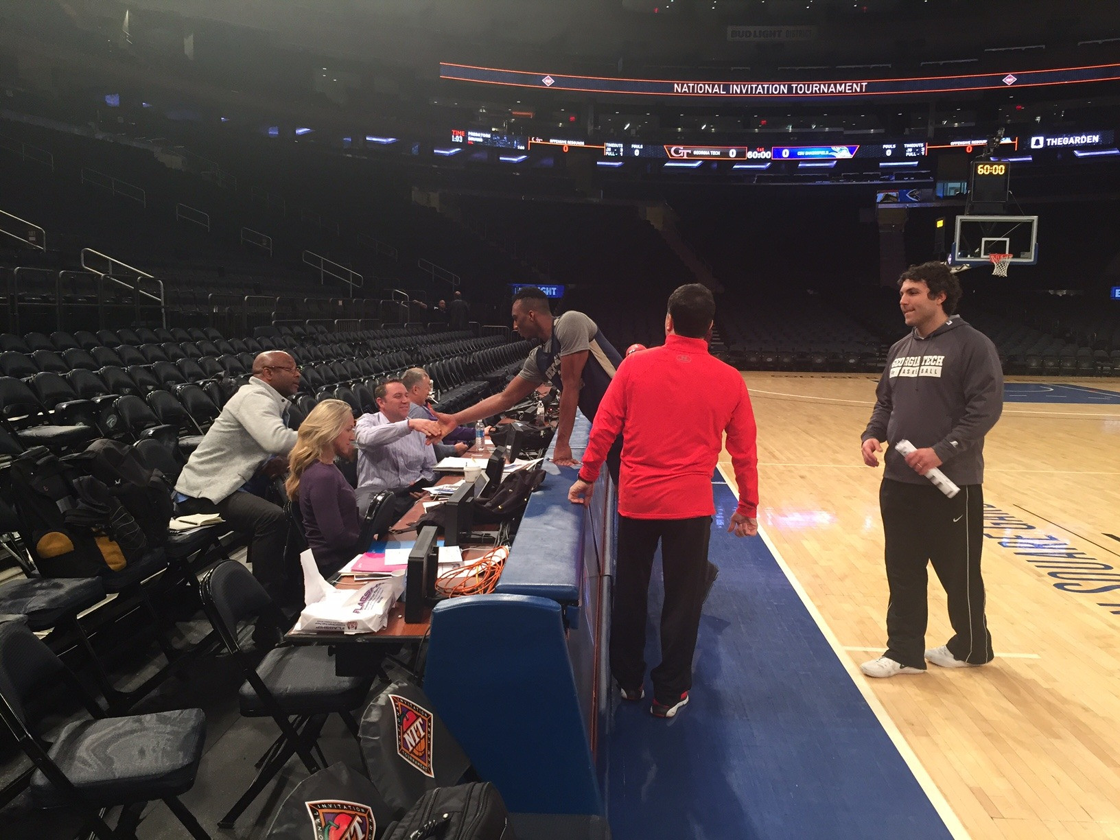 Josh Okogie and Coach Josh Pastner finishing up their conversations with ESPN talent.