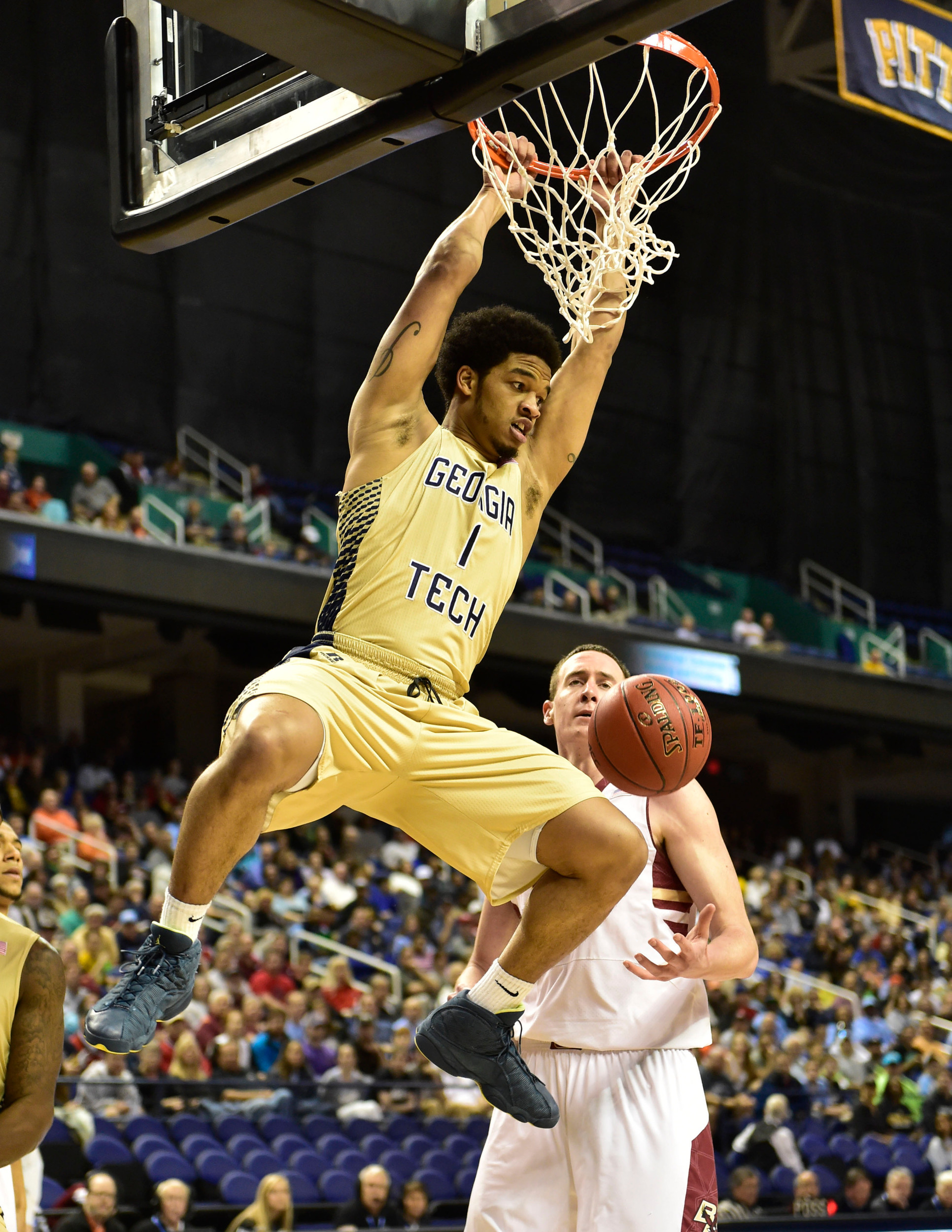 Georgia Tech Yellow Jackets guard Tadric Jackson (1) scores as Boston College Eagles center Dennis Clifford (24) defends in the first half first round of the ACC Tournament at Greensboro Coliseum. Mandatory Credit: Bob Donnan-USA TODAY Sports