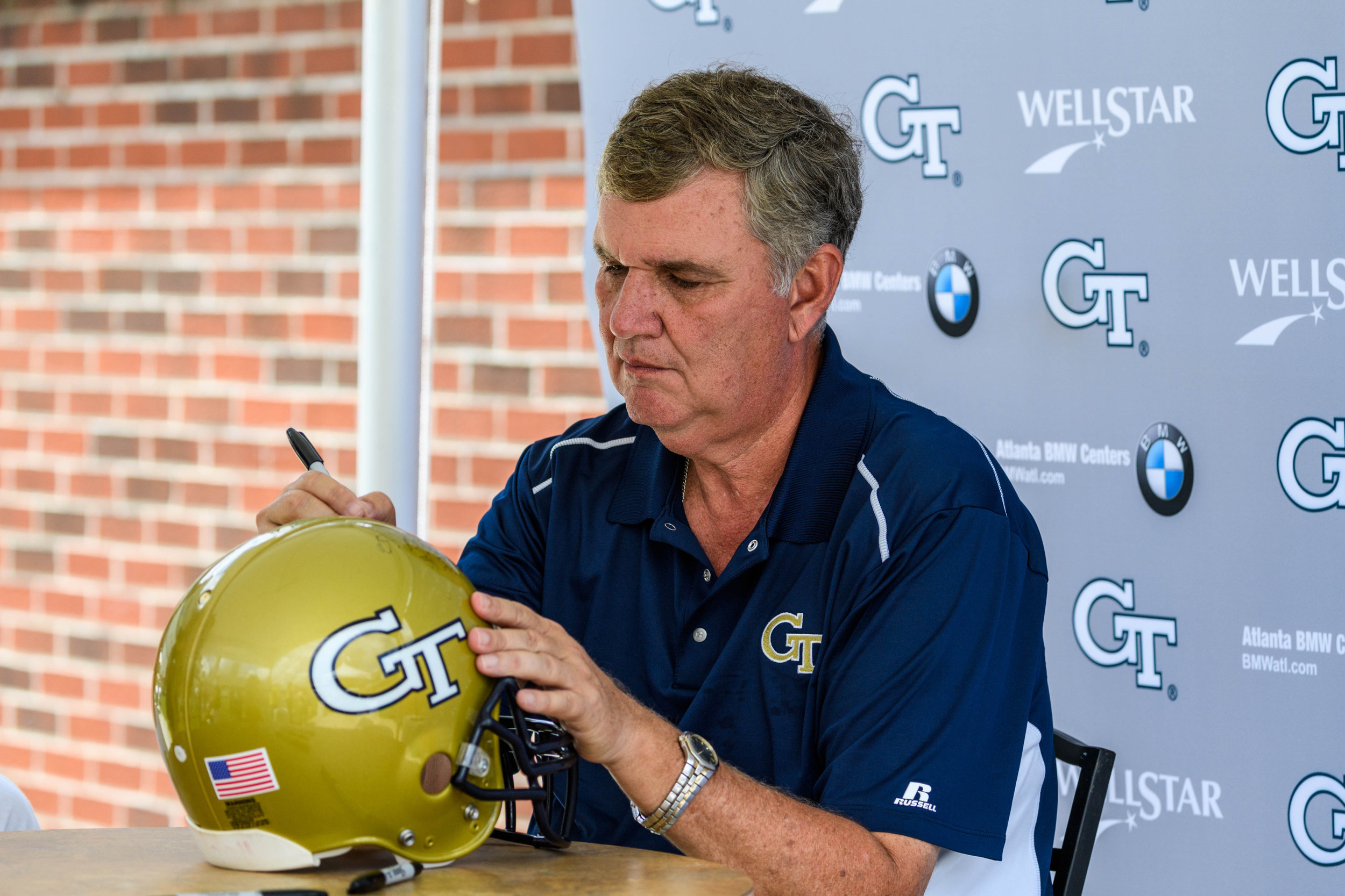 Coach Paul Johnson signs autographs at Fan Day
