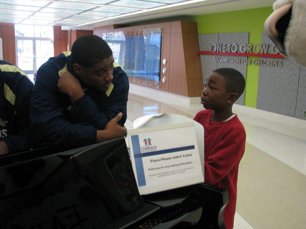 Yellow Jackets visit children at Egleston Hospital.