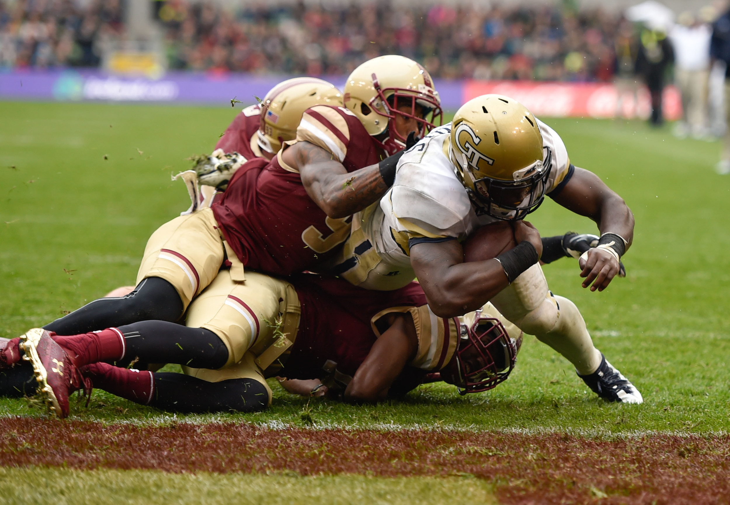 Sep 3, 2016; Dublin, IRL; Georgia Tech Yellow Jackets running back Dedrick Mills (26) dives over the line for a touchdown with only 35 seconds of the fourth quarter remaining of the game between the Boston College Eagles and the Georgia Tech Yellow Jackets at Aviva Stadium. Mandatory Credit: Steve Flynn-USA TODAY Sports