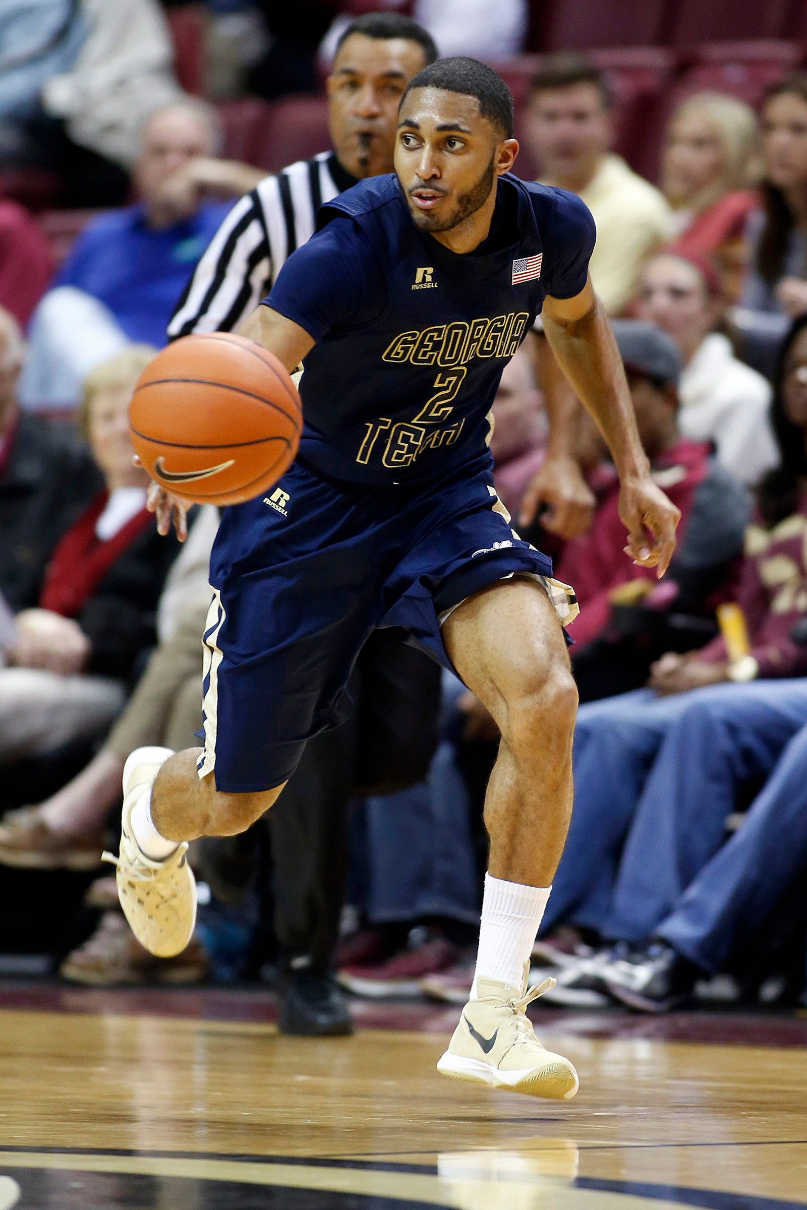 Adam Smith dribbles against Florida State Seminoles. Glenn Beil-USA TODAY Sports