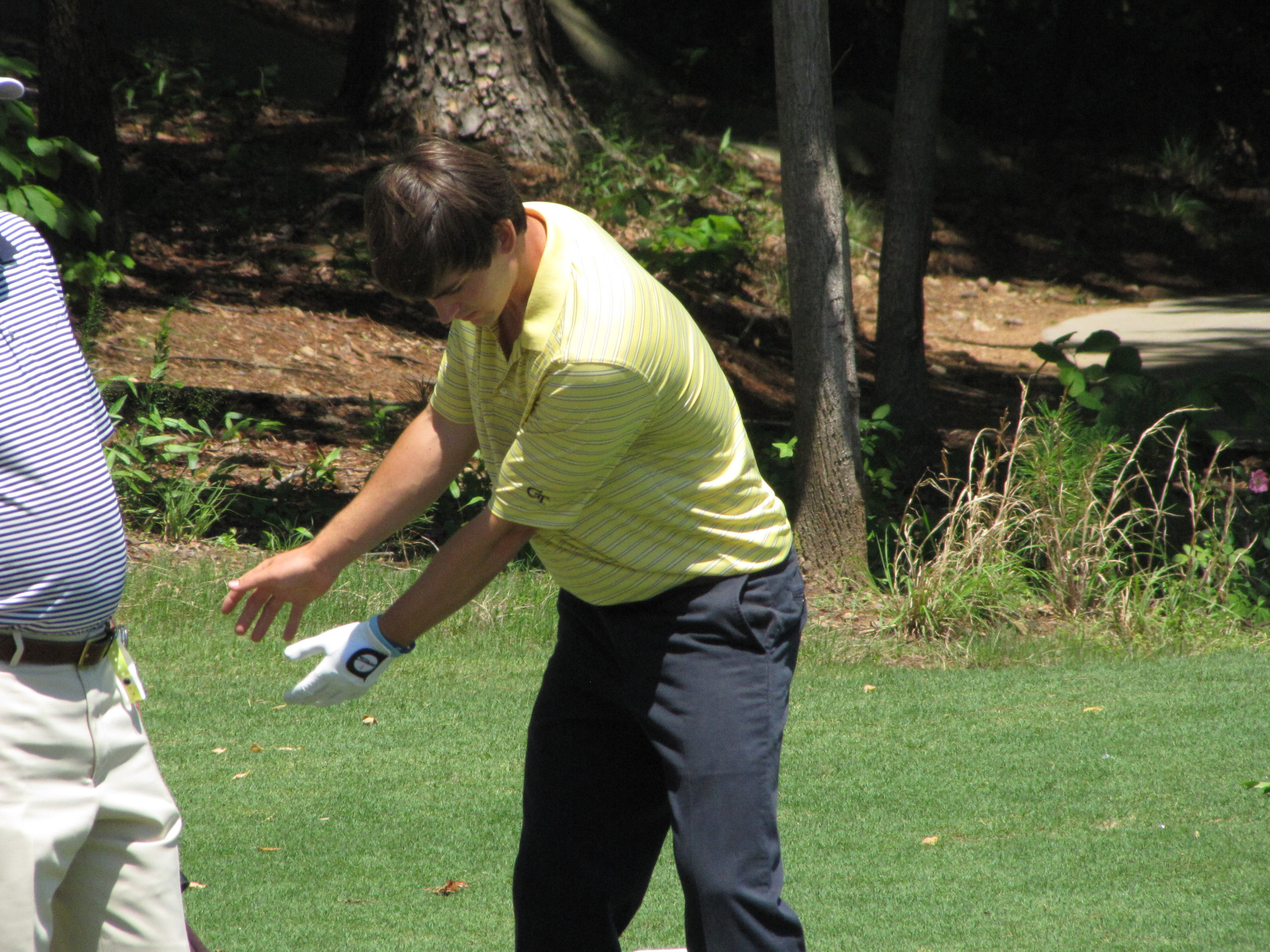 Ollie Schniederjans rehearses his swing while waiting at the 15th tee Friday at the NCAA Raleigh Regional, May 16, 2014