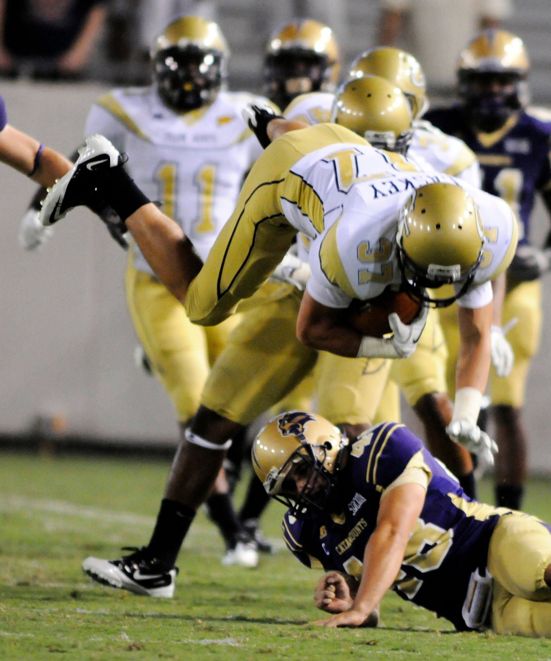 Georgia Tech punt returner Zach Laskey (37) is upended by Western Carolina player Blake Cain (48) on a return in the fourth quarter of an NCAA college football game in Atlanta, Thursday, Sept. 1, 2011. (AP Photo/Billy Weeks)
