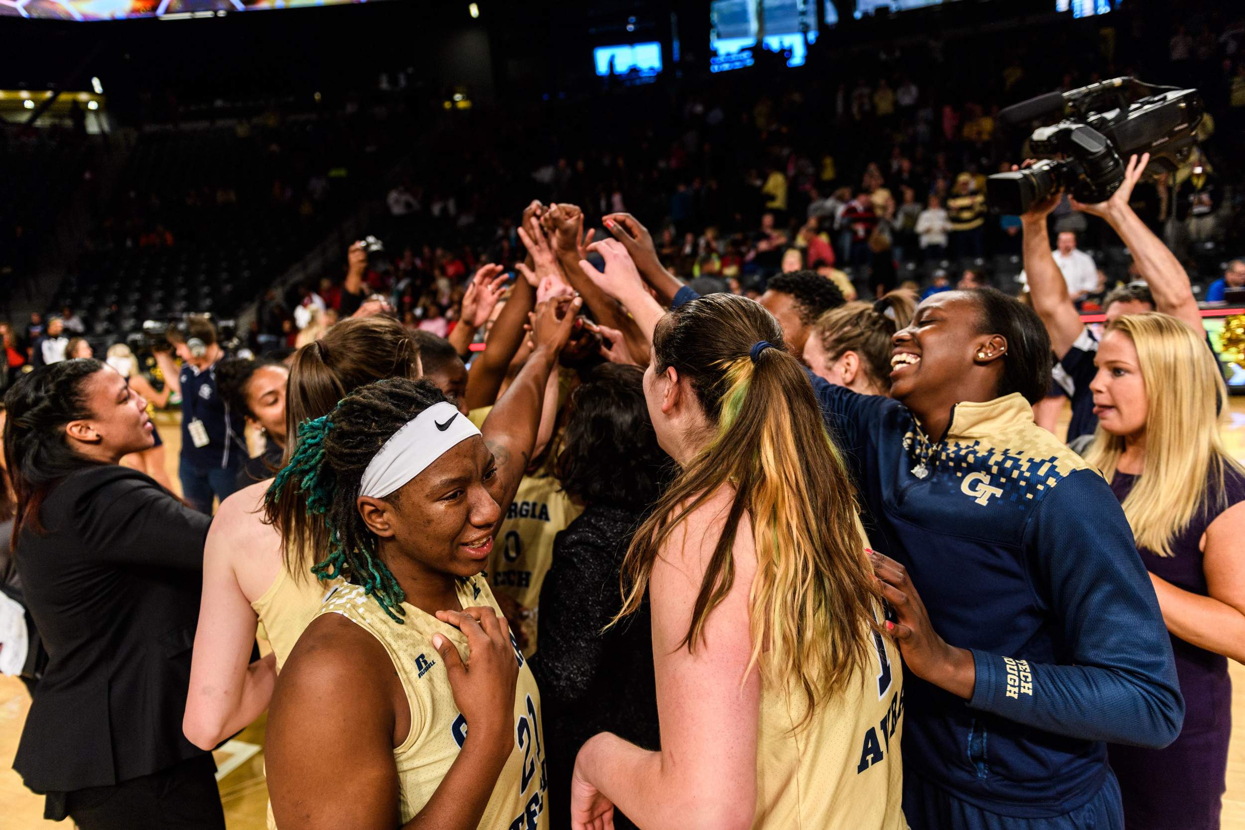 Coach Joseph celebrates with the team after the win