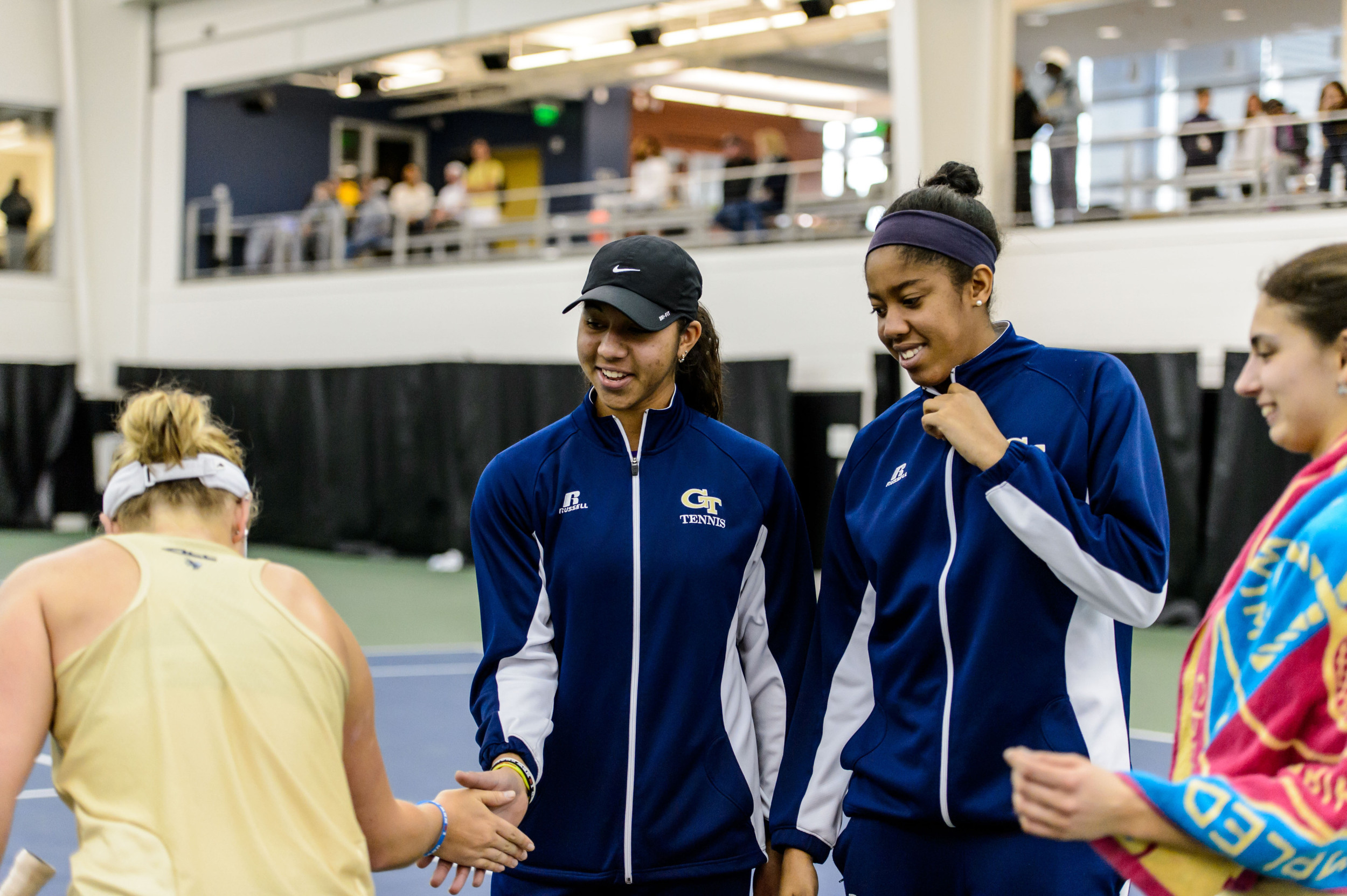 Paige Hourigan is congratulated on her win by Rasheeda McAdoo and Kendal Woodard