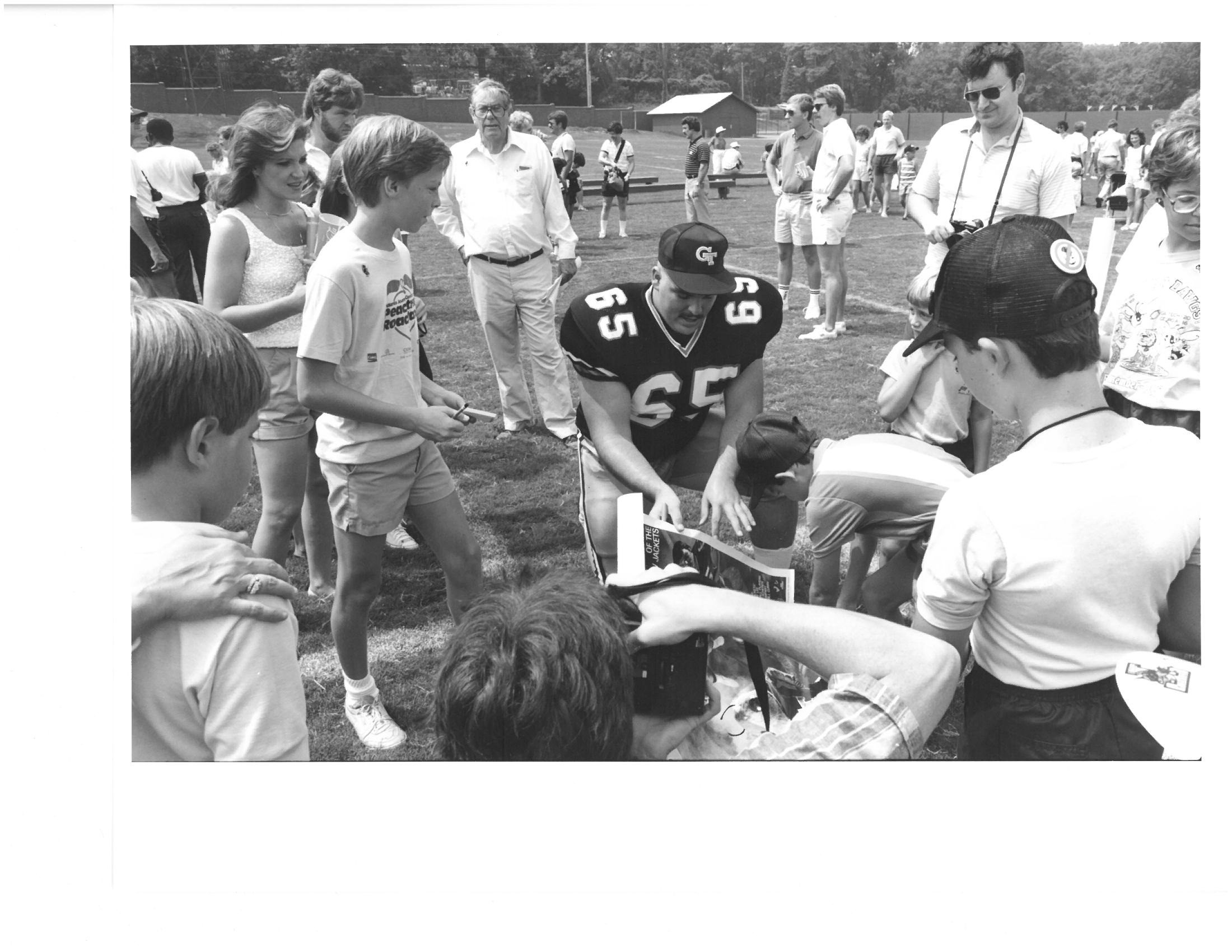 John Davis - All-American offensive lineman - signs autographs at Georgia Tech picture day