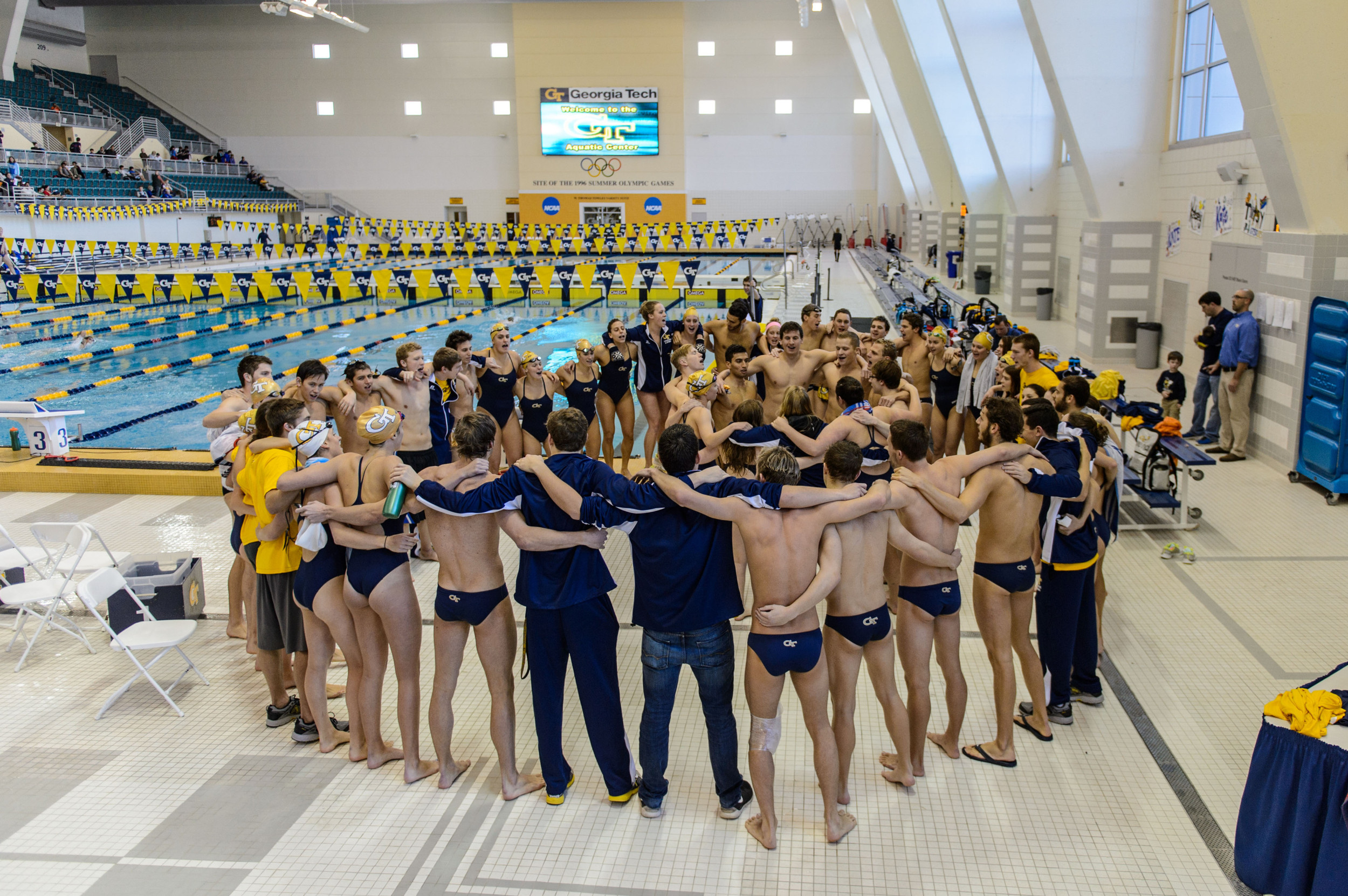 The team sings the fight song after the meet
