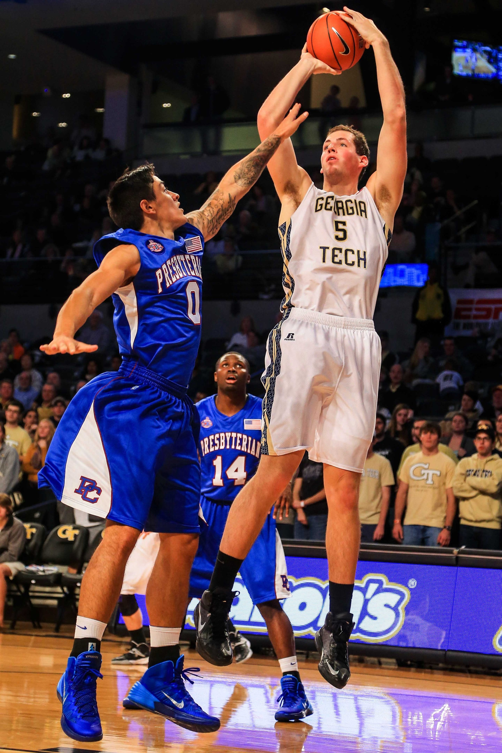 Nov 8, 2013; Atlanta, GA, USA; Georgia Tech Yellow Jackets center Daniel Miller (5) shoots a basket over Presbyterian Blue Hose forward Danny Herrera (0) in the first half at Hank McCamish Pavilion. Mandatory Credit: Daniel Shirey-USA TODAY Sports