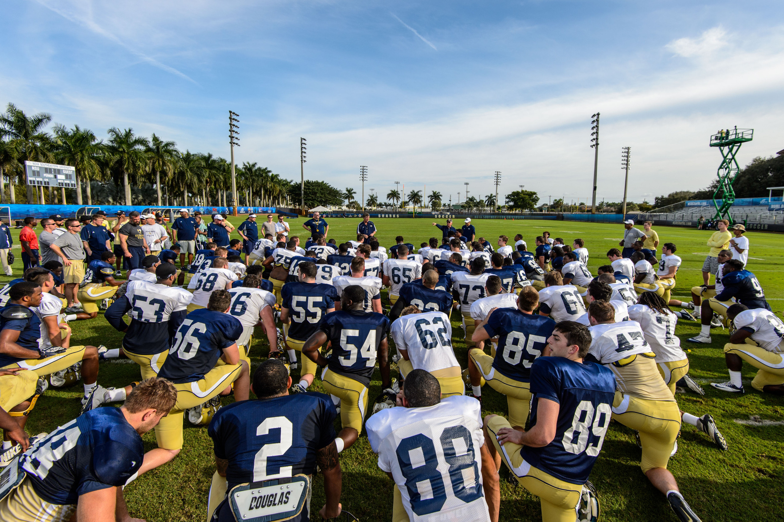 Coach Paul Johnson speaks to the team after practice