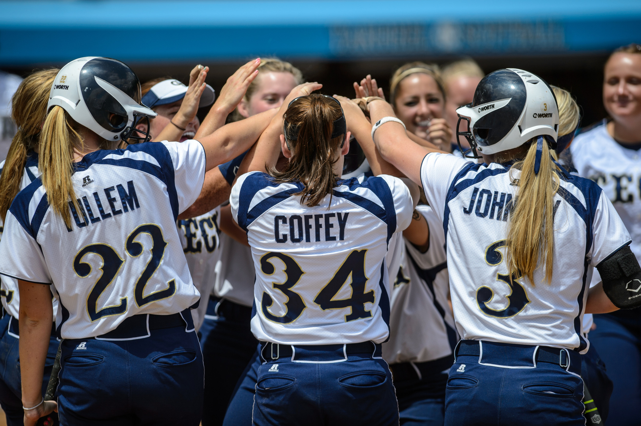 The team celebrates Shannon Bear's home run.