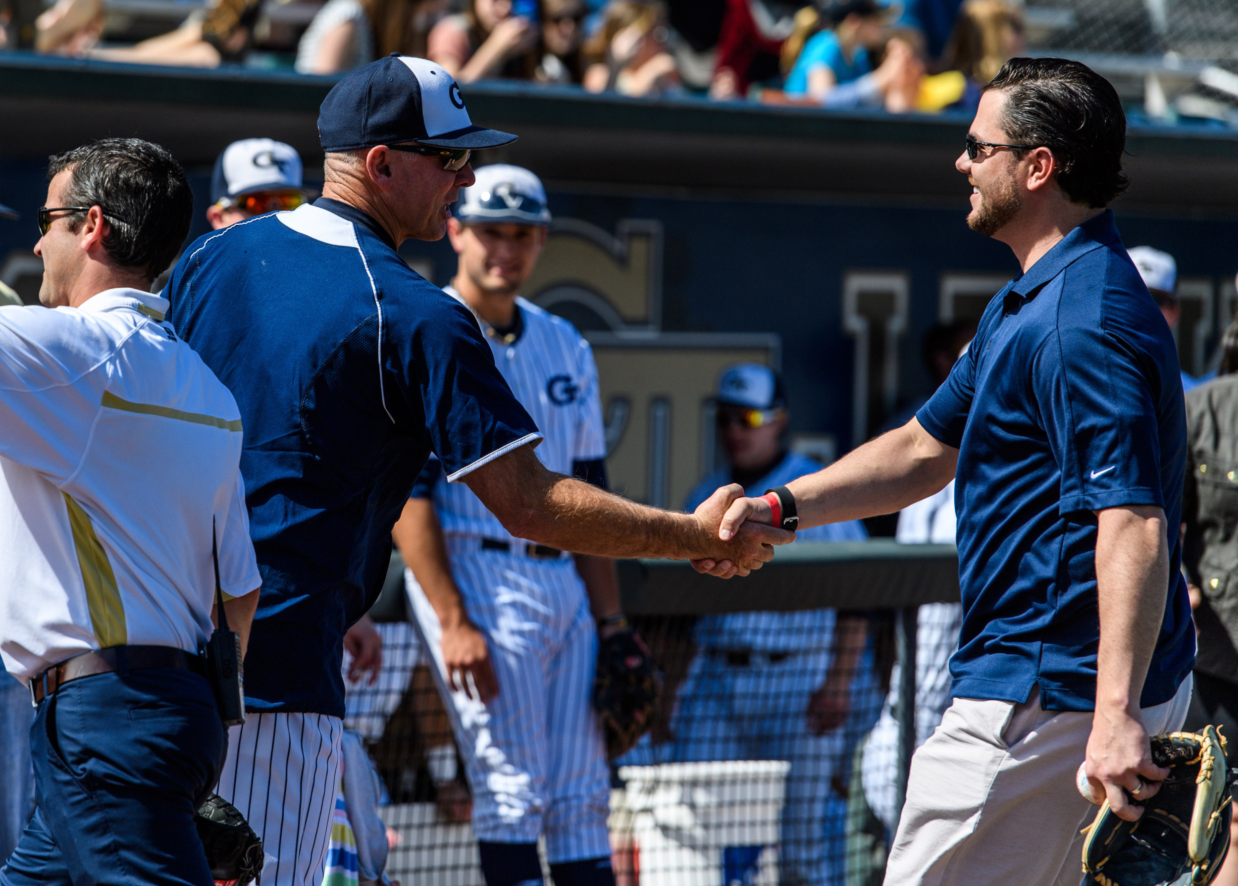 Coach Danny Hall (17) greets Lee Hyde