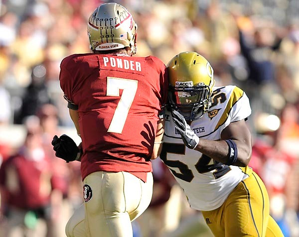 Sedric Griffin (54) applies pressure to FSU quarterback Christian Ponder. Photo by LensEffects