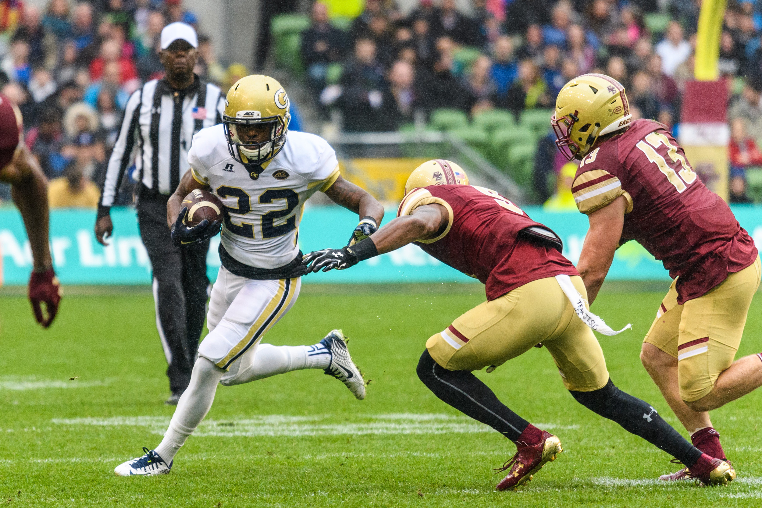 Georgia Tech A-Back Clinton Lynch (22) evades Boston College Defensive Back John Johnson (9) and Linebacker Connor Strachan (13) during the first half of an NCAA football game, Saturday, Sept. 3, 2016, in Dublin, Ireland. (Danny Karnik/Georgia Tech via AP)