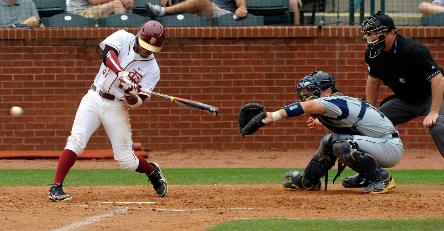 Florida Stat'es Sheman Johnson (32) bats as Georgia Tech's A.J. Murray (9) catches during the ACC Baseball Championship May 23, 2012 in Greensboro, N.C. (Photo by Sara D. Davis/theACC.com)