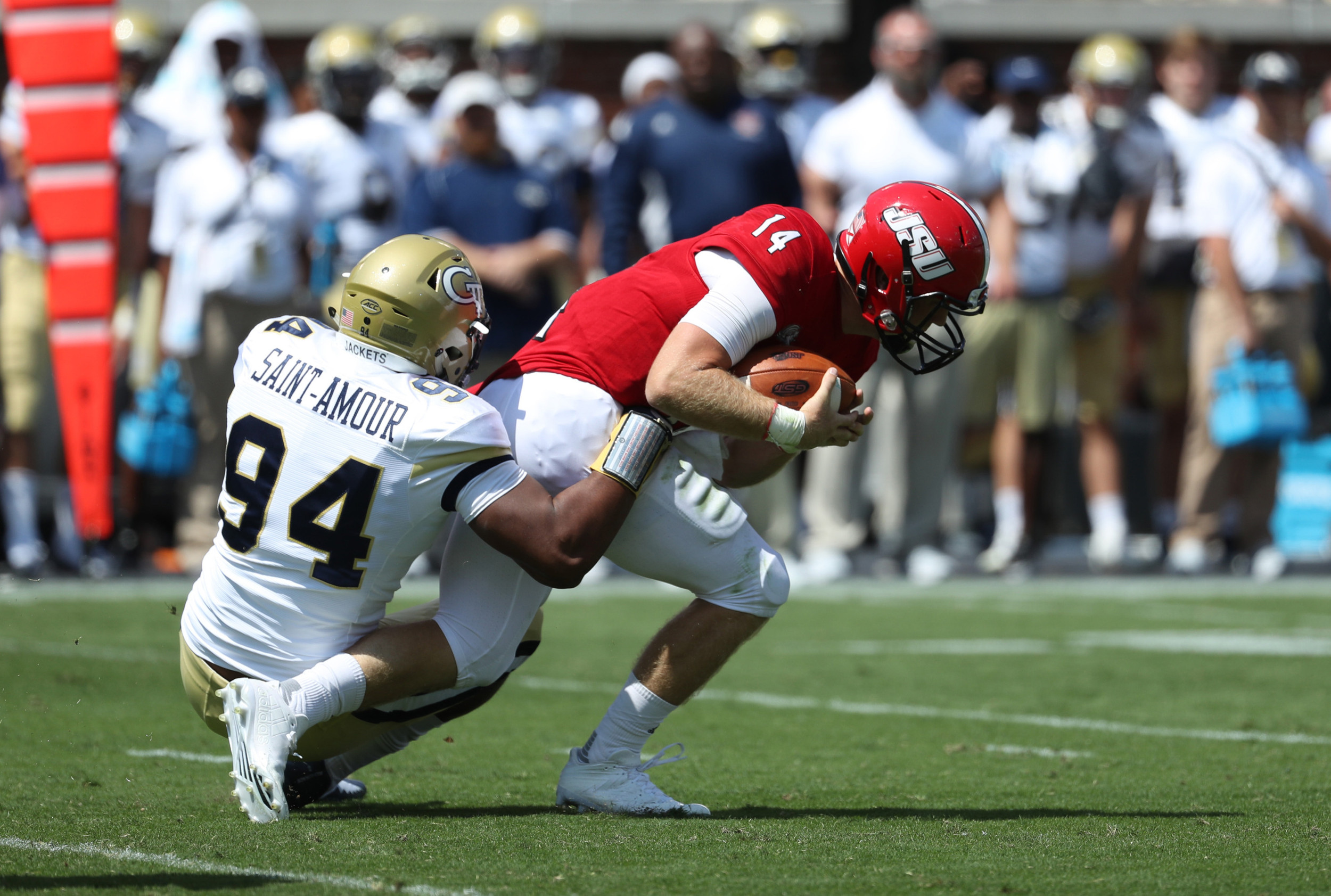 Jackets defensive lineman Anree Saint-Amour (94) tackles Jacksonville State Gamecocks quarterback Bryant Horn (14) in the first quarter. Jason Getz-USA TODAY Sports
