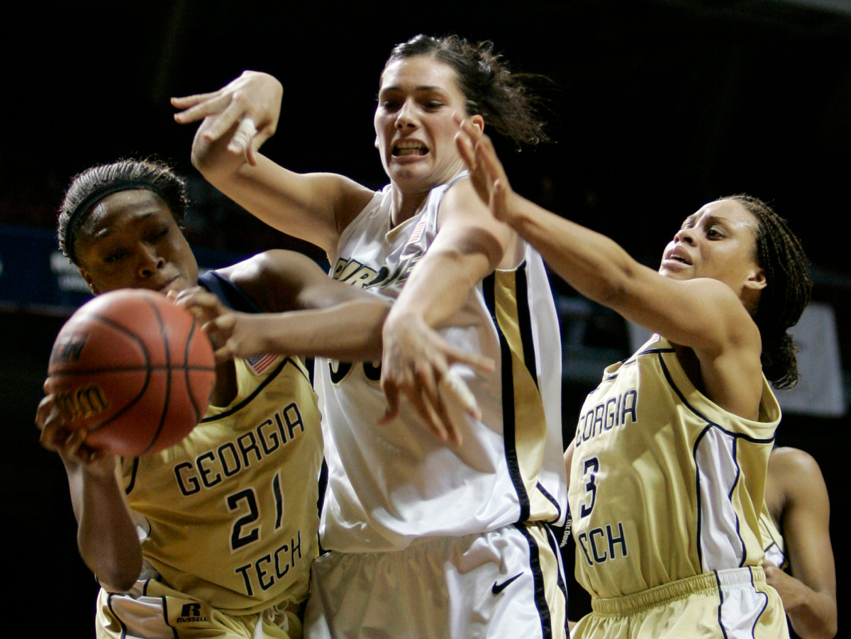 Janie Mitchell steals the ball from Purdue forward Erin Lawless, center, as guard Stephanie Higgs, right, adds pressure during the second half of an NCAA second-round game in Minneapolis, Monday, March 19, 2007. (AP Photo/Ann Heisenfelt)