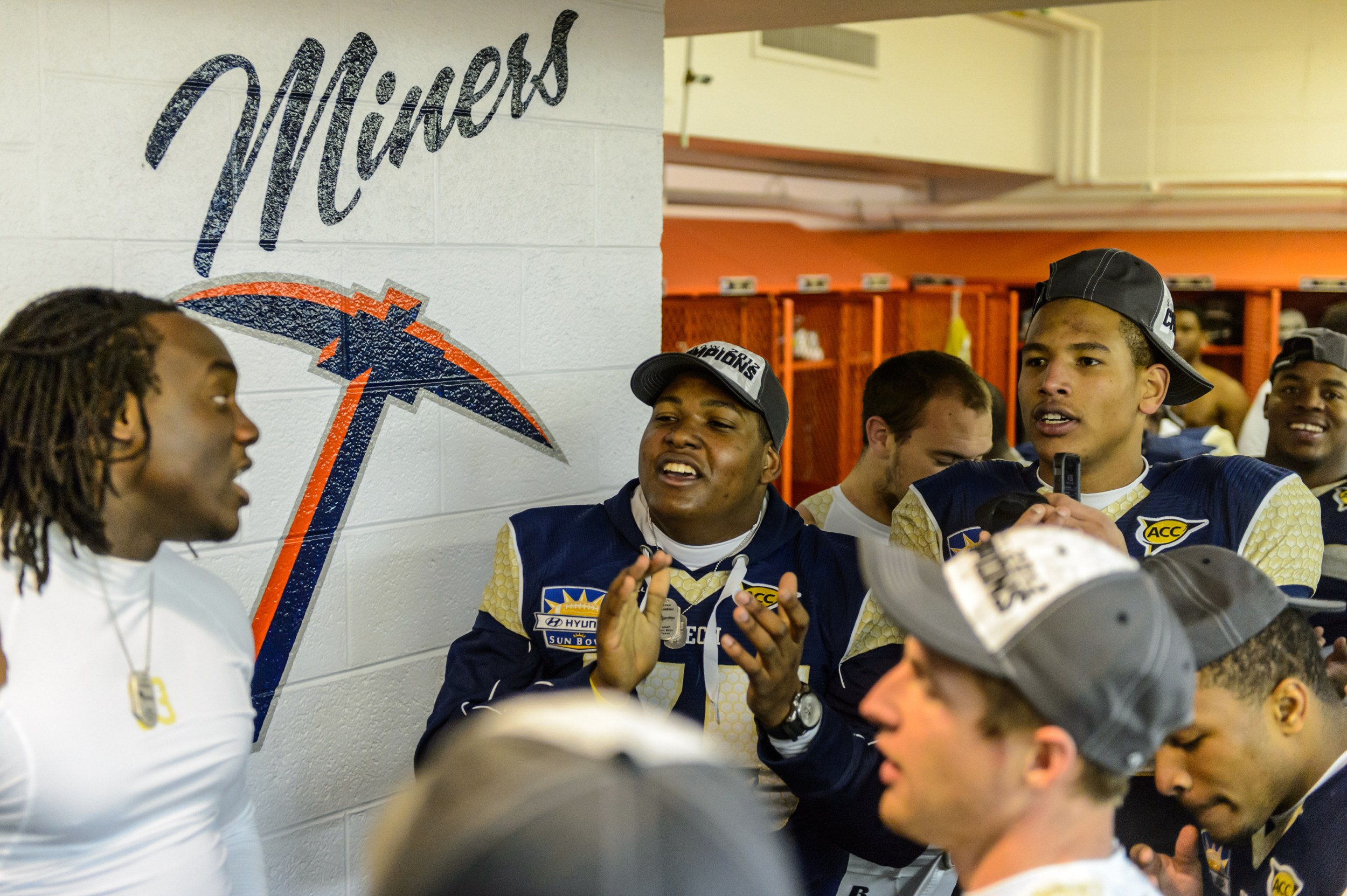 The players celebrate in the locker room after the win.